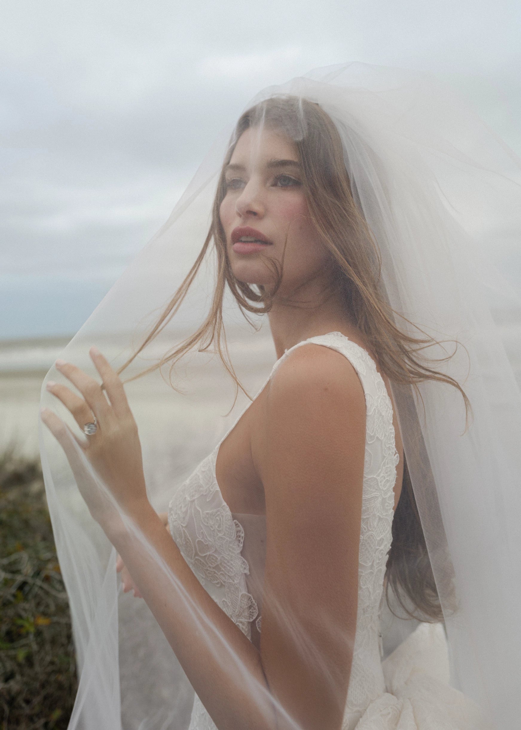 The Blue Willow Ashley Veil is a cathedral veil with a Scrollwork Embroidery edge in Pearl.