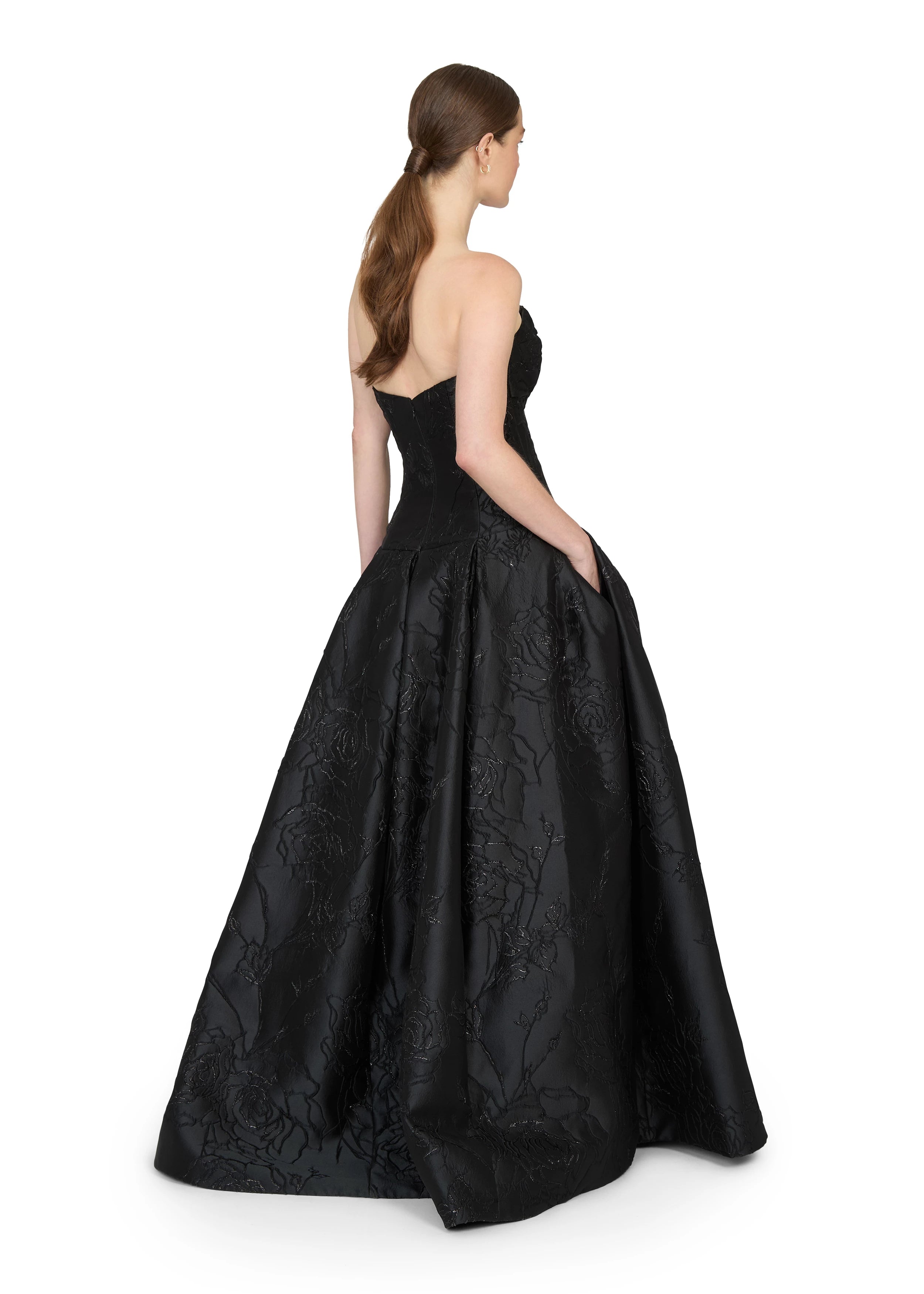 Anne Barge evening gown Letizia, is an arched strapless drop waist ballgown of Camellia Vine Jacquard with neckline draping and pleated skirt.