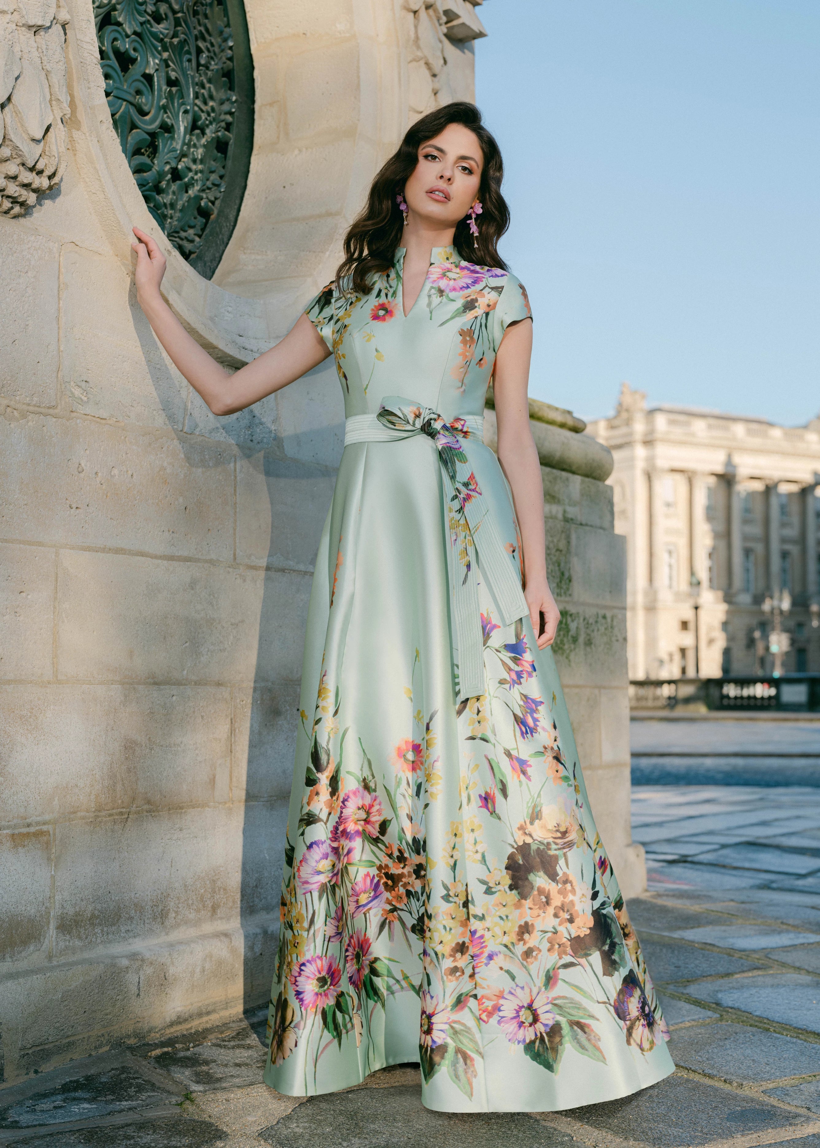 The Honfleur Watercolor evening gown from Black Label by Anne Barge is a cap sleeve V-notch A-line gown of Watercolor Meadow Printed Mikado in Pistachio.