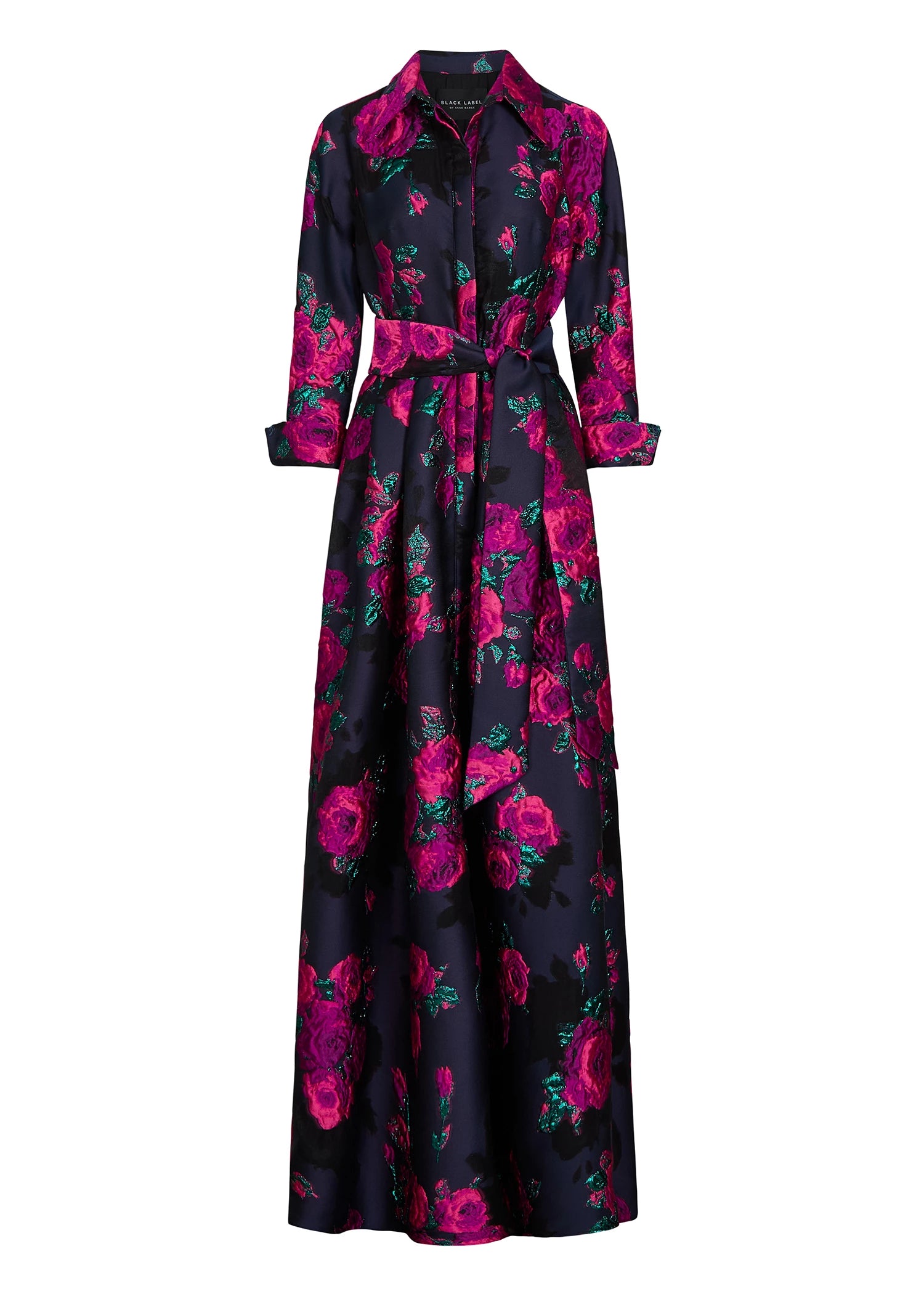 The Montaigne evening gown from Black Label by Anne Barge is a classic 3/4 sleeve shirt-style A-line gown of Bouquet Organza Jacquard in Magenta/Navy.
