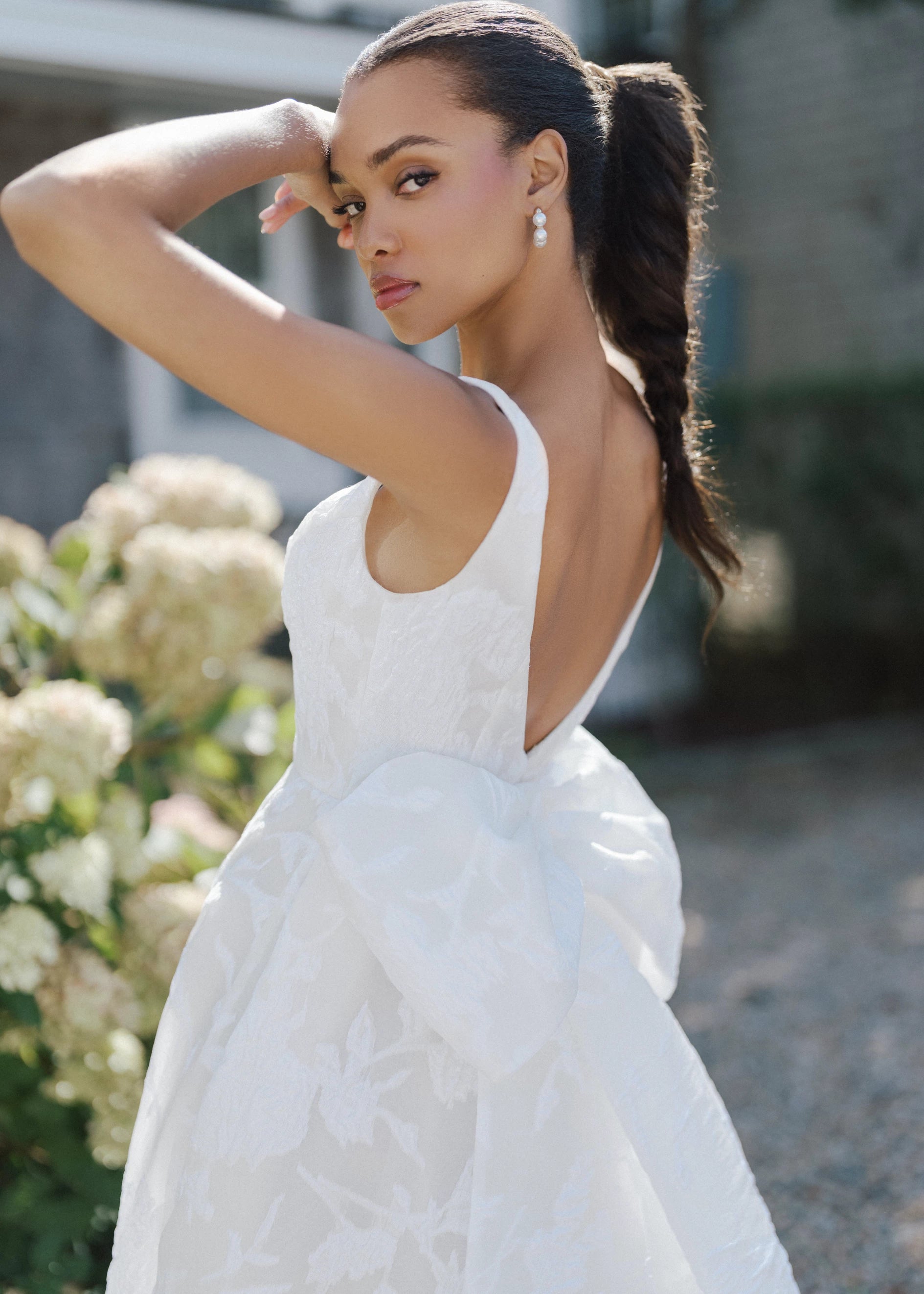 The Blue Willow Liberty Bow is a dramatic oversized symmetrical bow of Floral Jacquard Burnout Organza with streamers in Silk White.