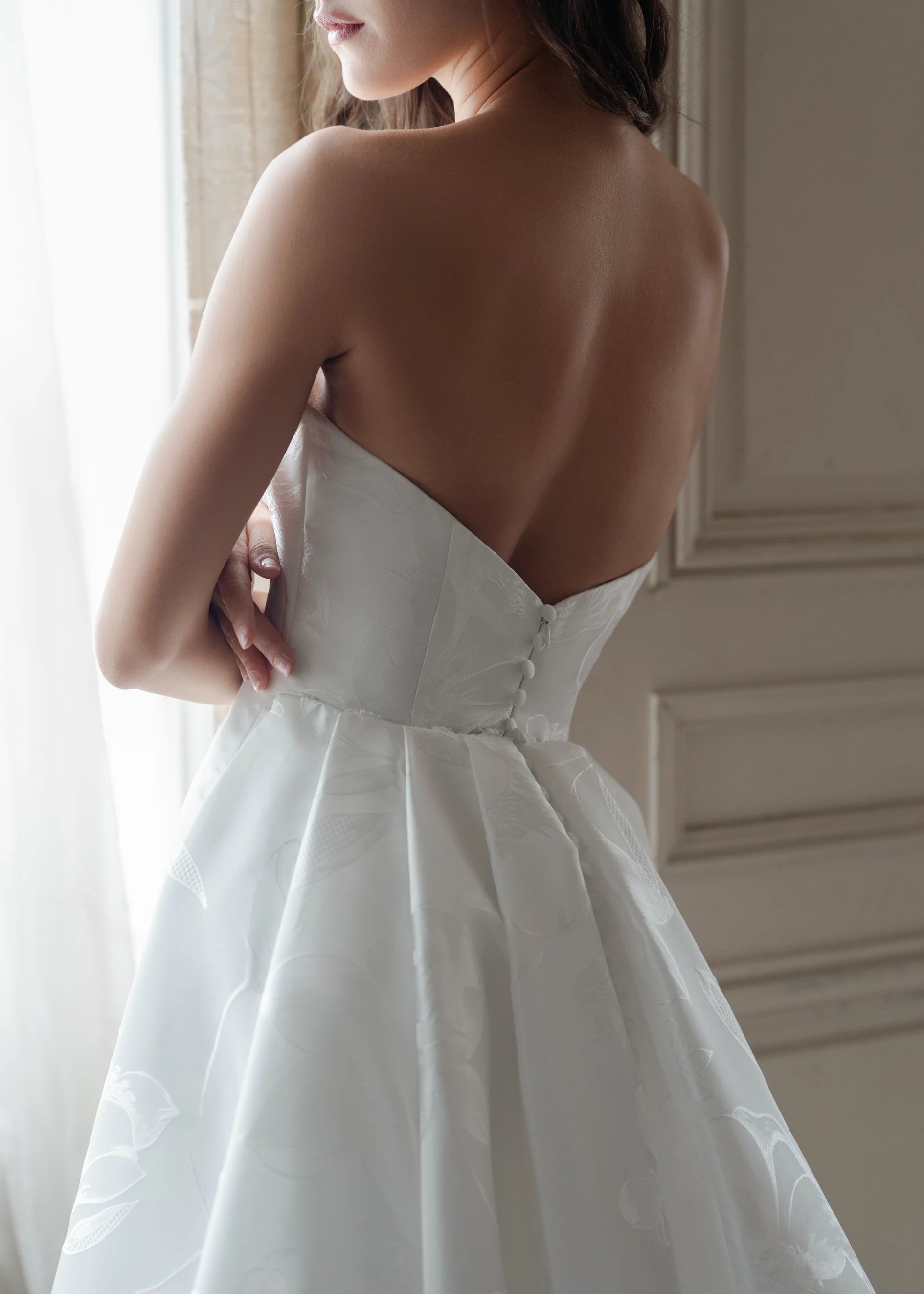 The Blue Willow Rinaldo Train is a dramatic pleated detachable train of Magnolia Jacquard with buttons to the hem in Silk White.