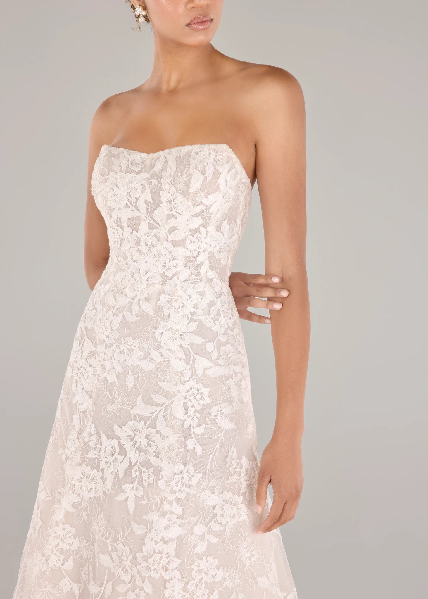 The Cromwell gown is a strapless soft A-line gown with allover Threaded Floral Embroidery