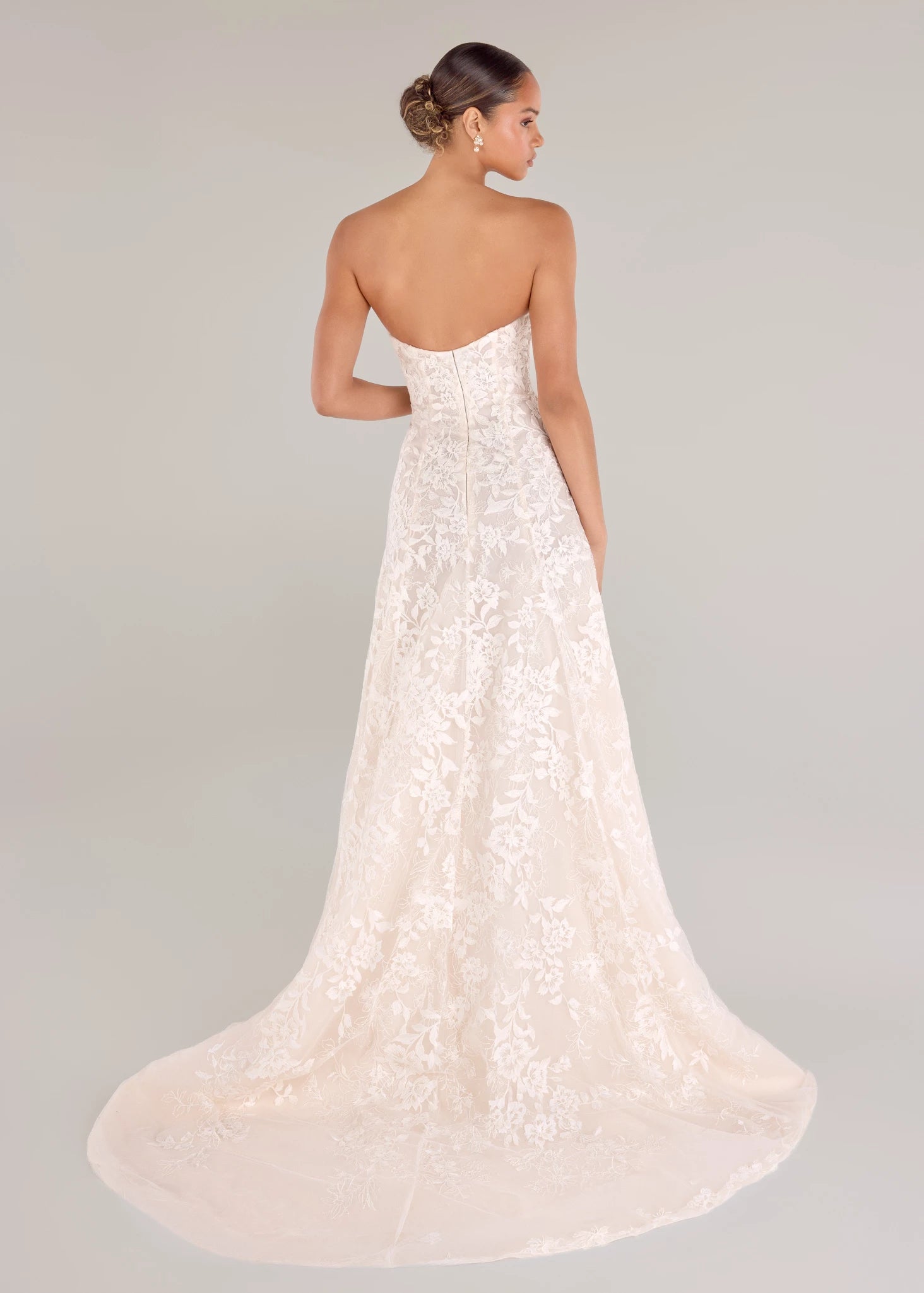The Cromwell gown is a strapless soft A-line gown with allover Threaded Floral Embroidery