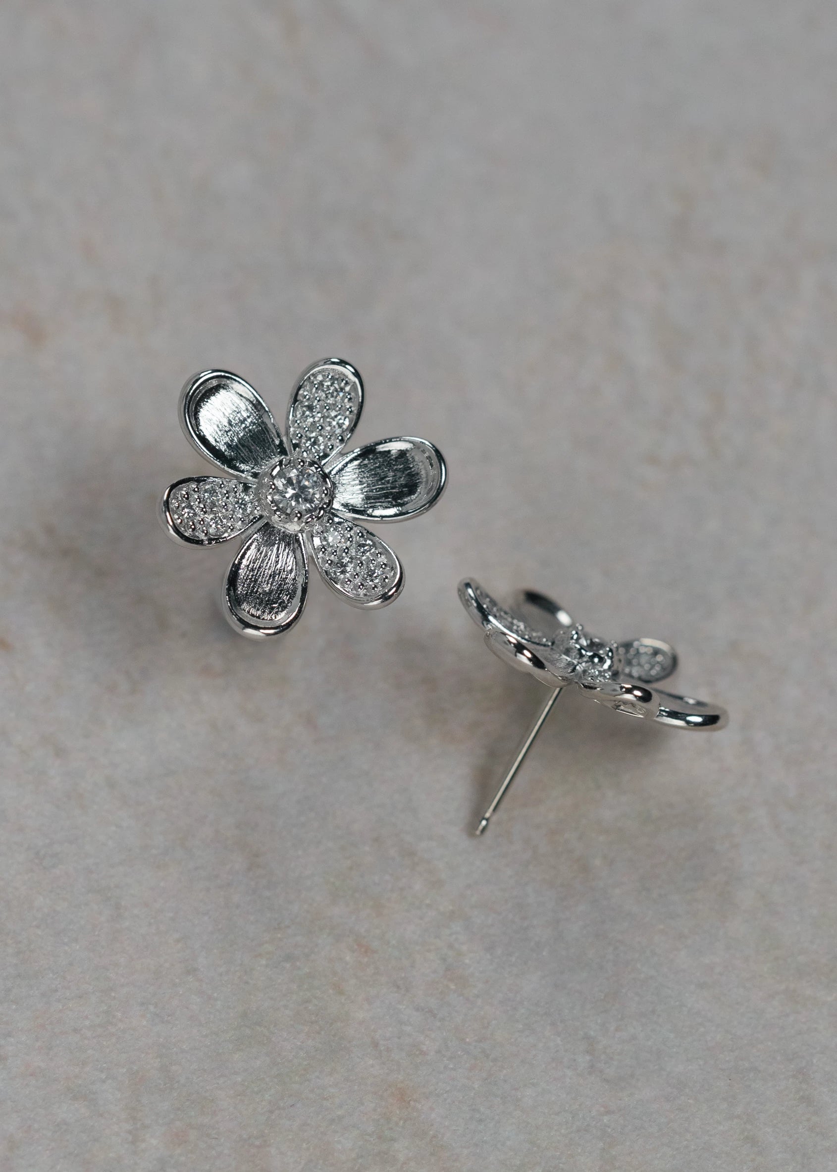 Designed by Atlanta jewelry designer Laura Pearce, delicate Daisy pave diamond flower studs, featuring 0.38 CTTW in brilliant diamonds, and available in 18K Yellow or White Gold.