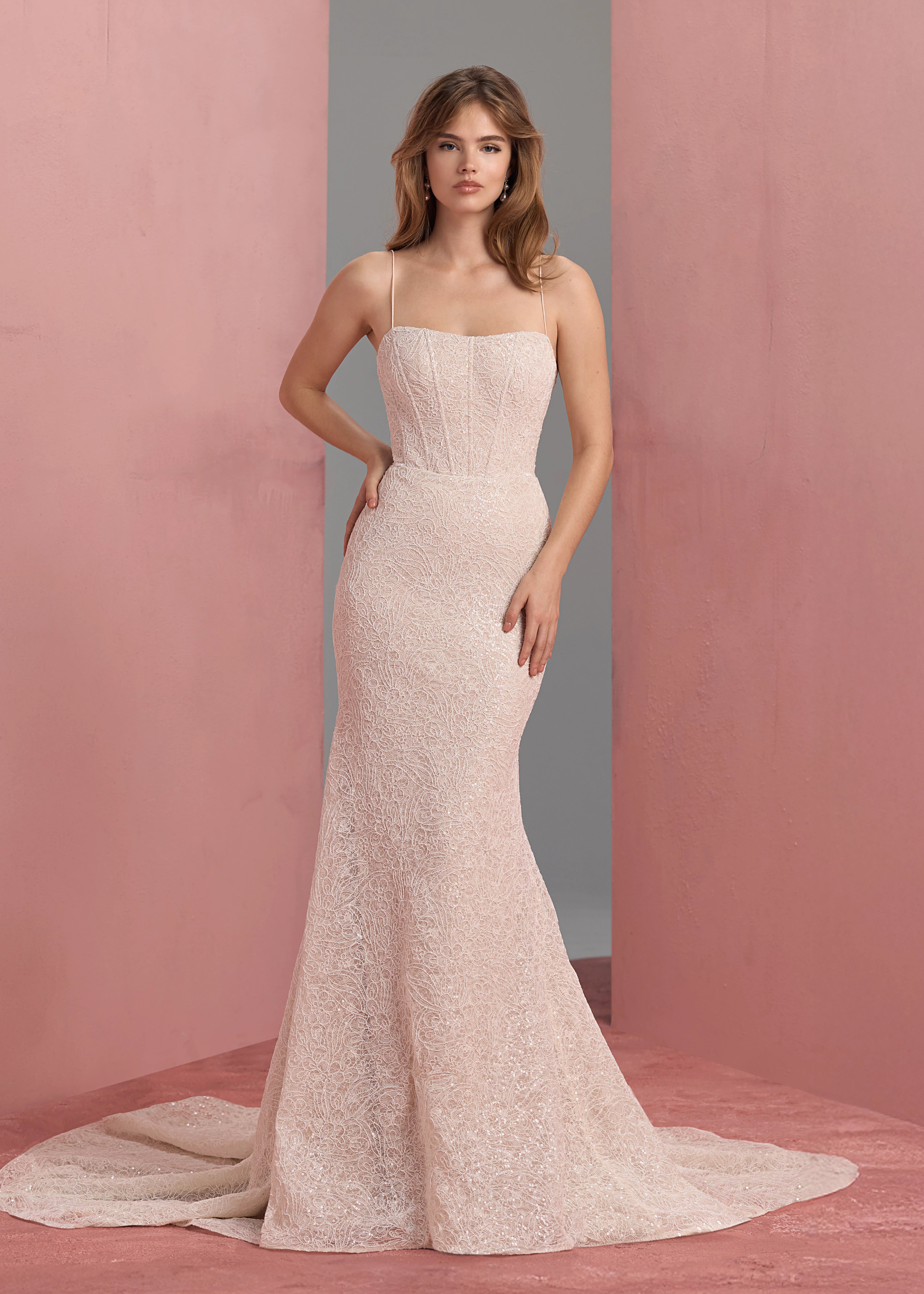 The Delia gown by Anne Barge is a spaghetti strap contour neckline gown with molded corset and softly flared skirt, in sequined corded embroidery over Chantilly lace in Silk White / Nude. Add on the Delia Detachable Train, a dramatic detachable train of sequined corded embroidery over Chantilly lace.