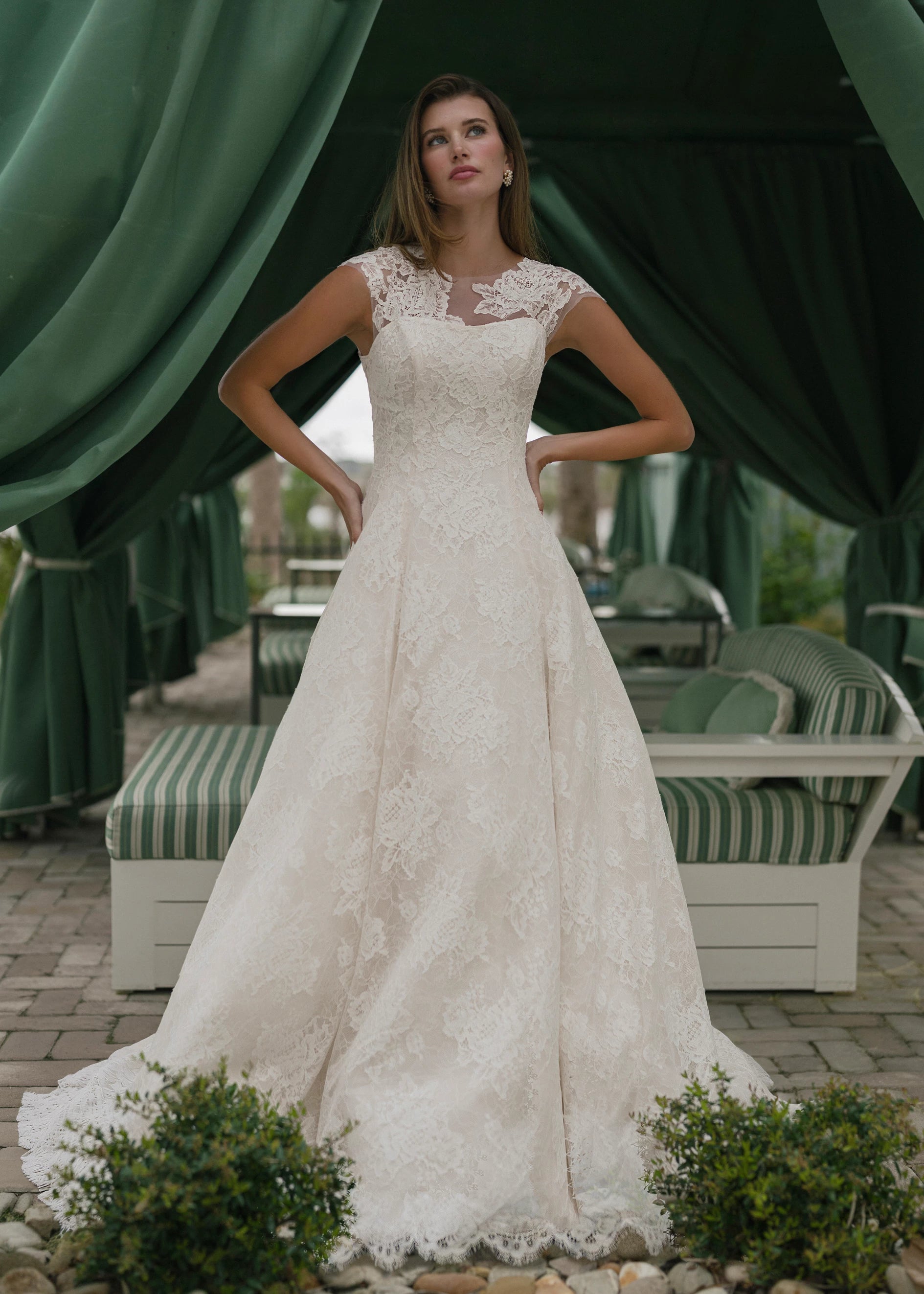 The Dunlin gown is a strapless contoured neckline collapsed A-line of Blossom Corded Lace with Chantilly and soft Gazar underlay.