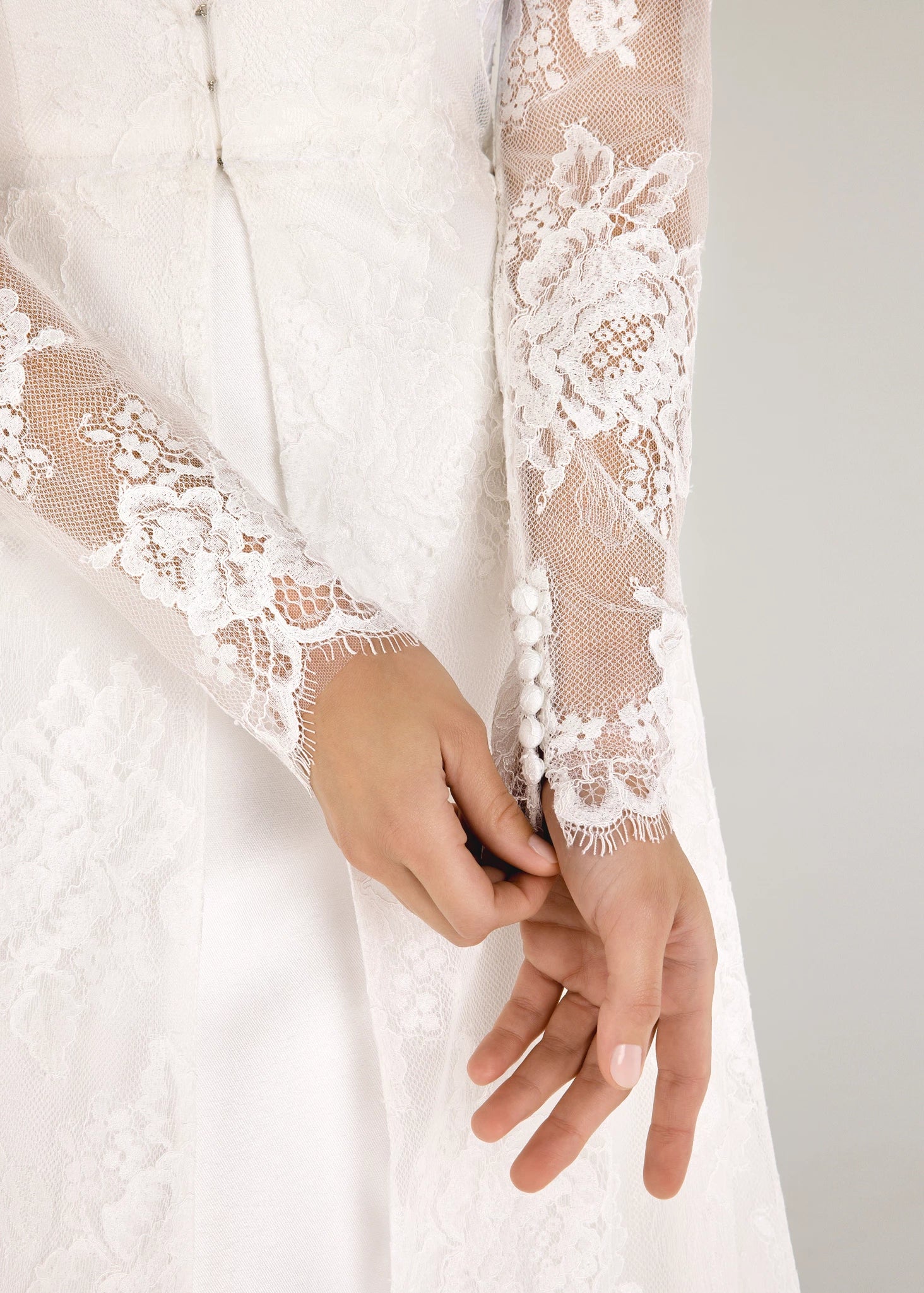 The Blue Willow Edmund Coat is a long sleeve V-neck coat of Blossom Corded Lace with scallop hem in Silk White.