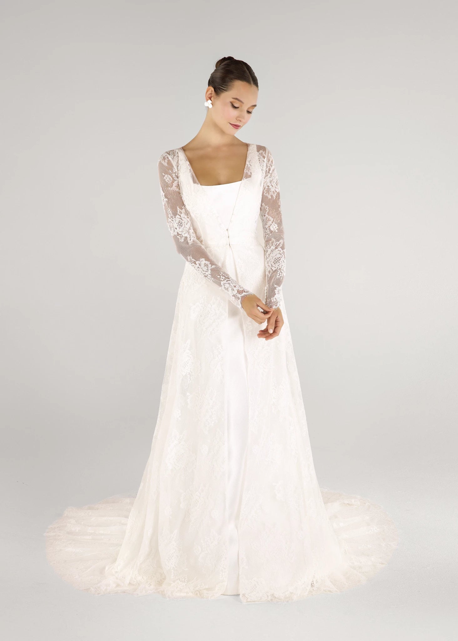 The Blue Willow Edmund Coat is a long sleeve V-neck coat of Blossom Corded Lace with scallop hem in Silk White.