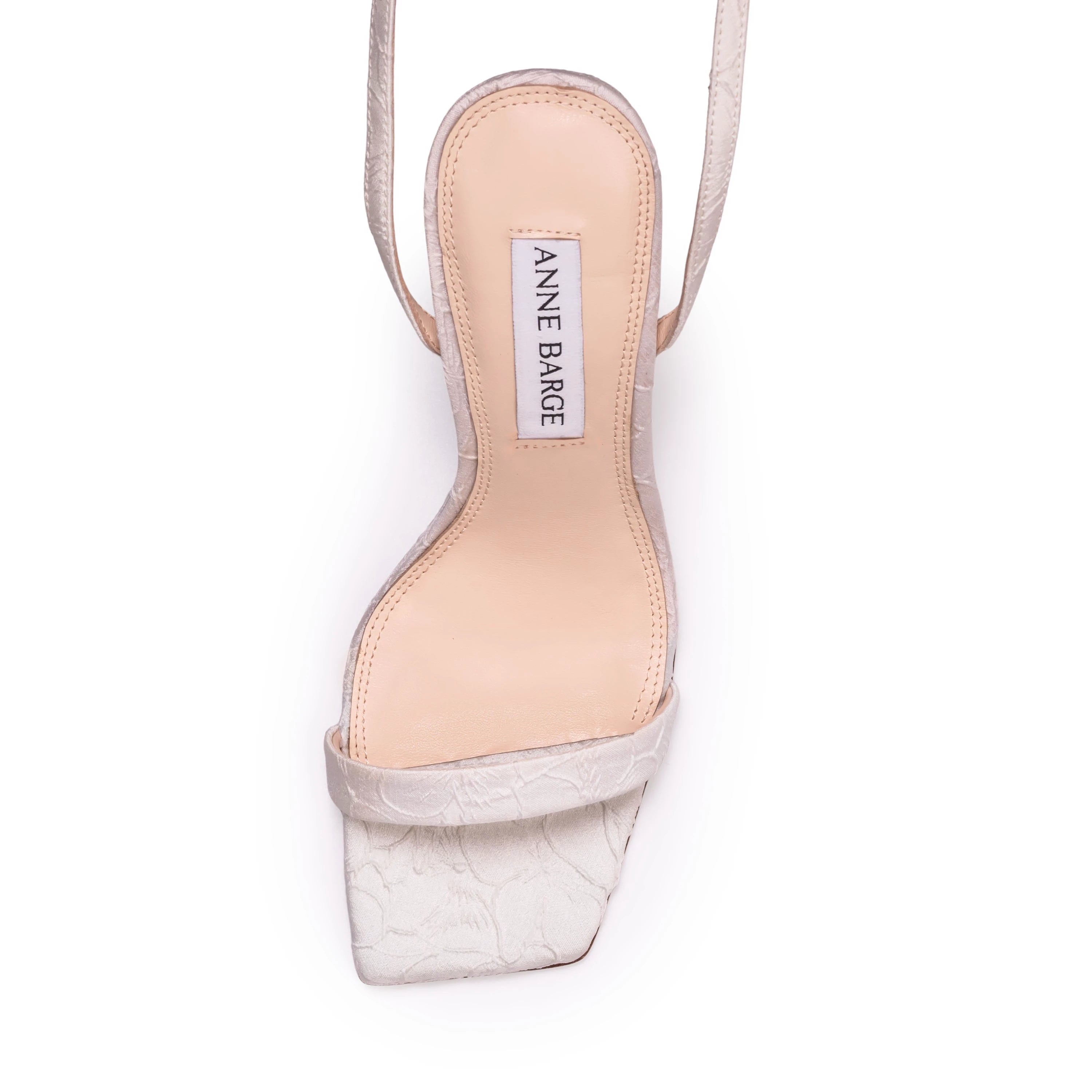 A square-toe wedge sandal set on a classic 95mm heel, featuring a sleek, minimalist upper accented by a square crystal-embellished buckle. Expertly crafted from refined satin jacquard.