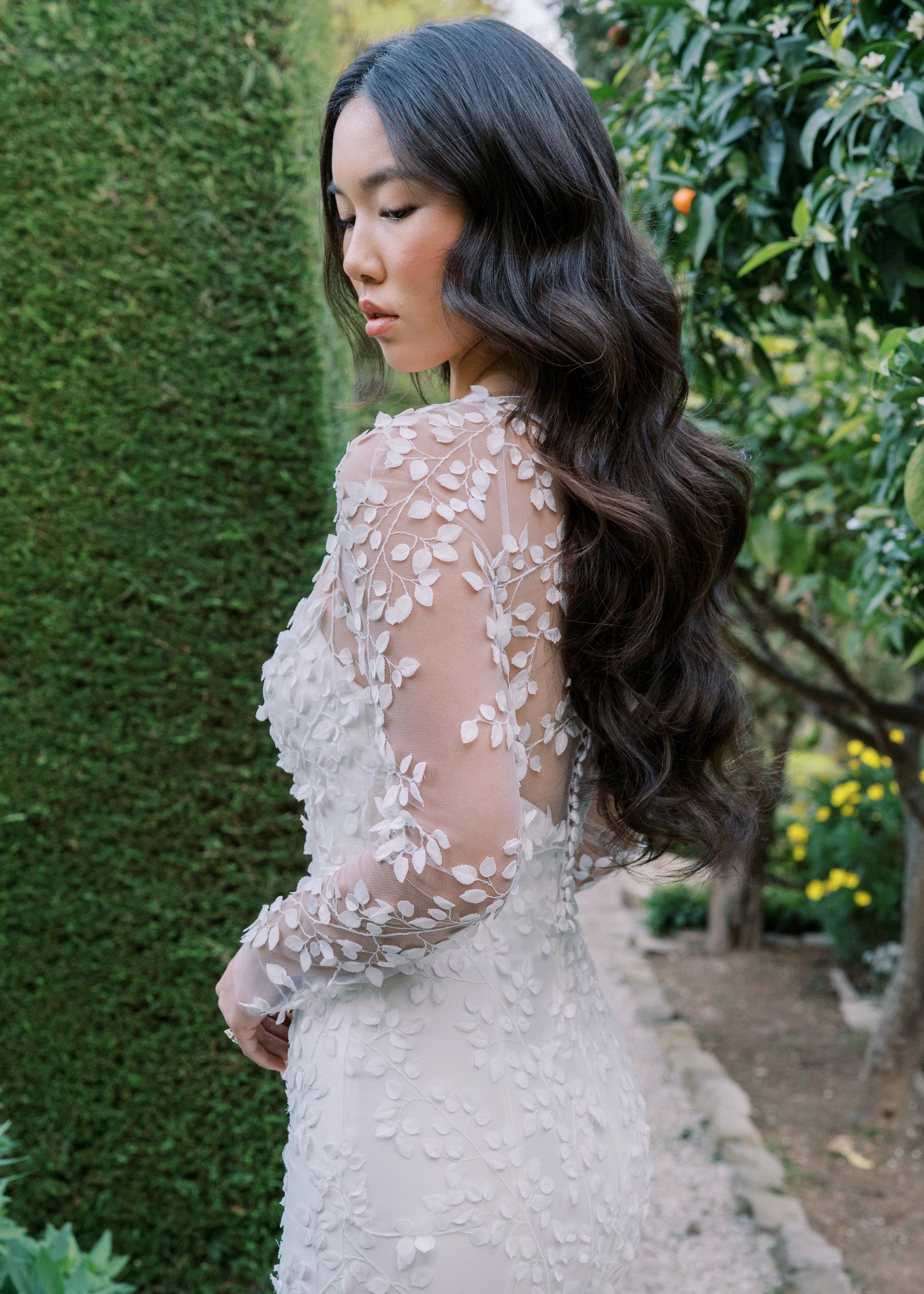 The Blue Willow Fleur De Lis Topper, an illusion long sleeved top with 3D leaf embroidery in Silk White.