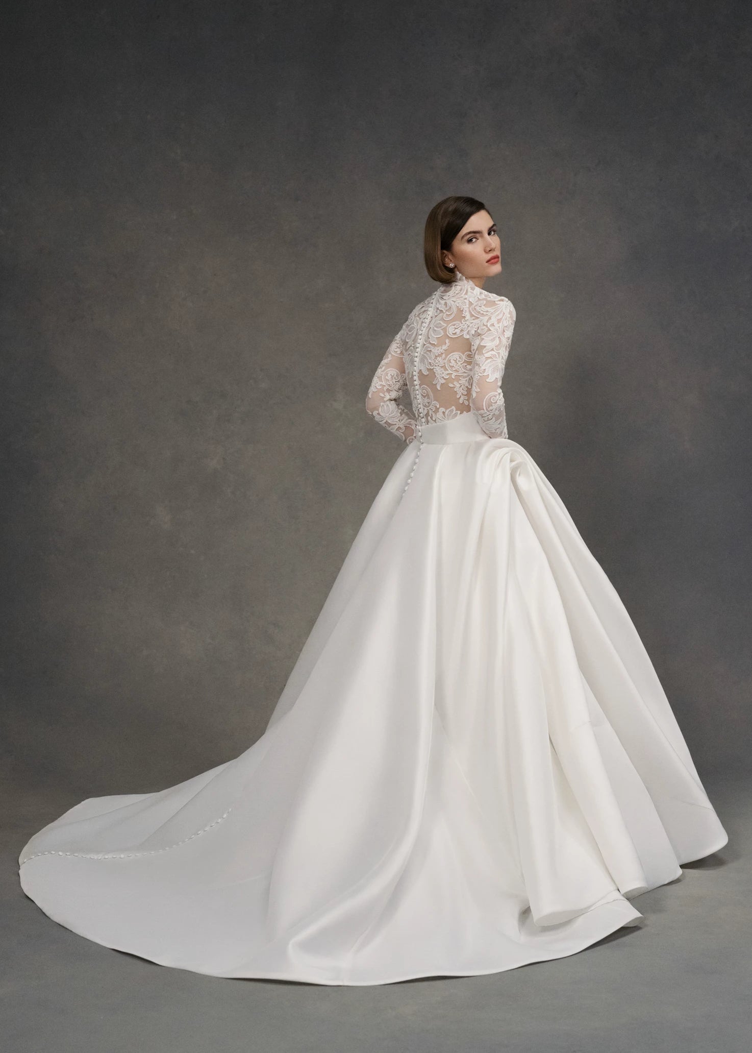 The Gigi Topper by Anne Barge is an Illusion tulle long sleeve mockneck top appliquéd with French Alençon lace in Silk White.
