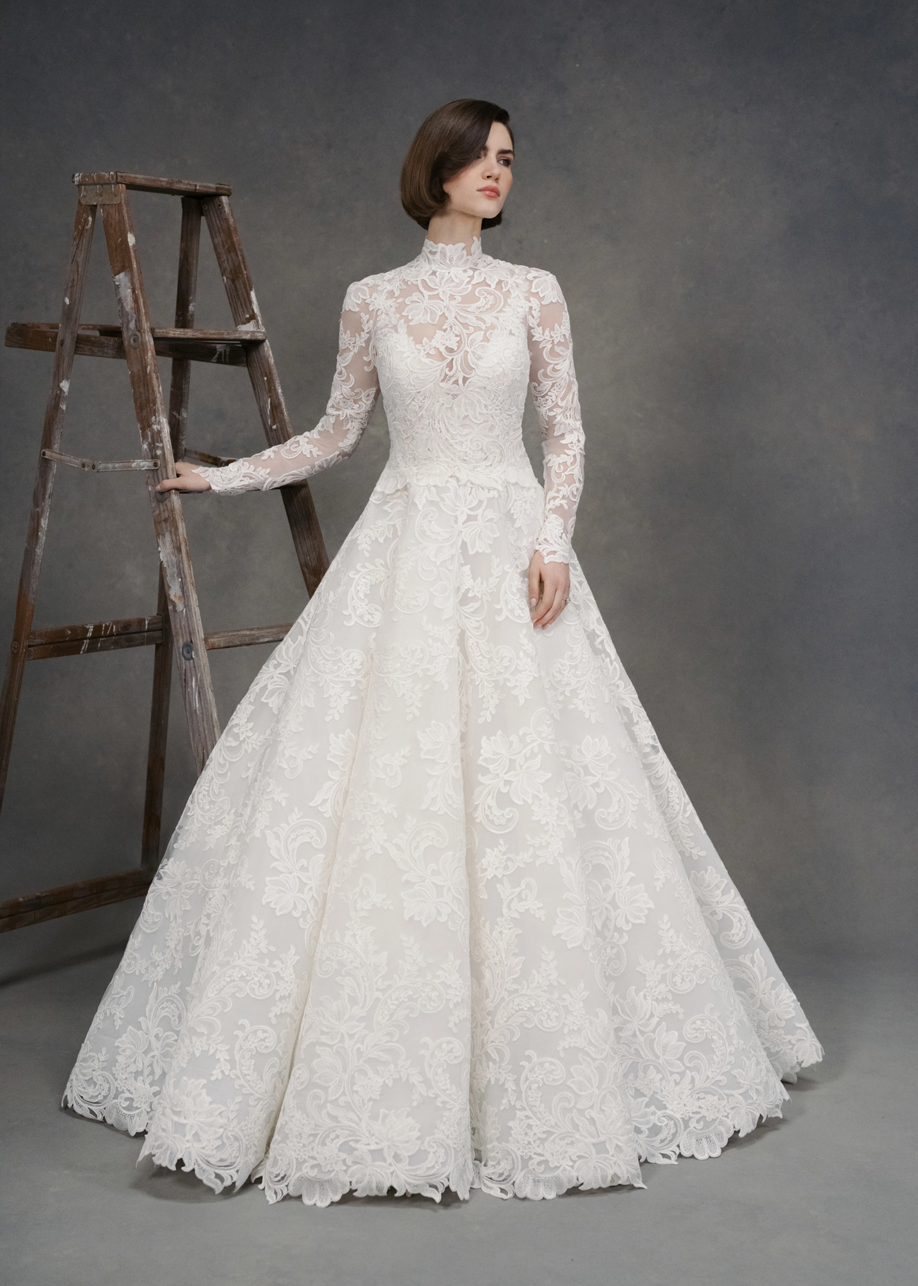 The Gigi Topper by Anne Barge is an Illusion tulle long sleeve mockneck top appliquéd with French Alençon lace in Silk White.