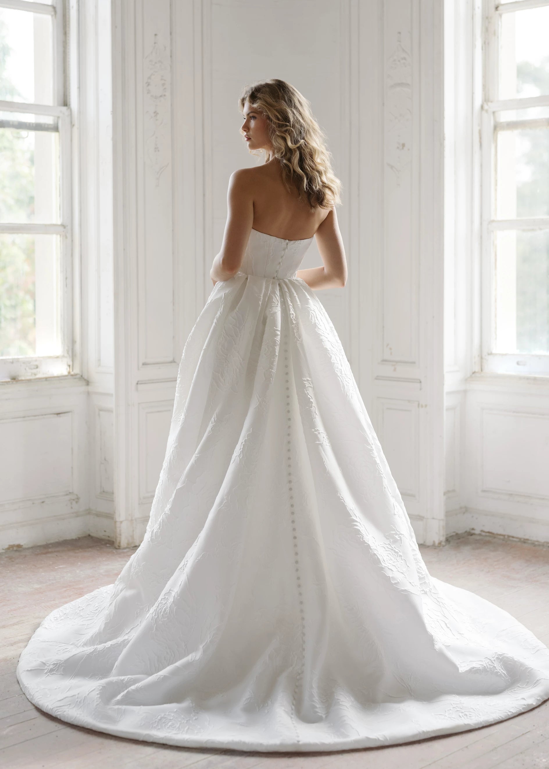 The Heather Train by Anne Barge is a dramatic box pleated detachable train of Rose Embroidered Jacquard with buttons to the hem in Silk White.