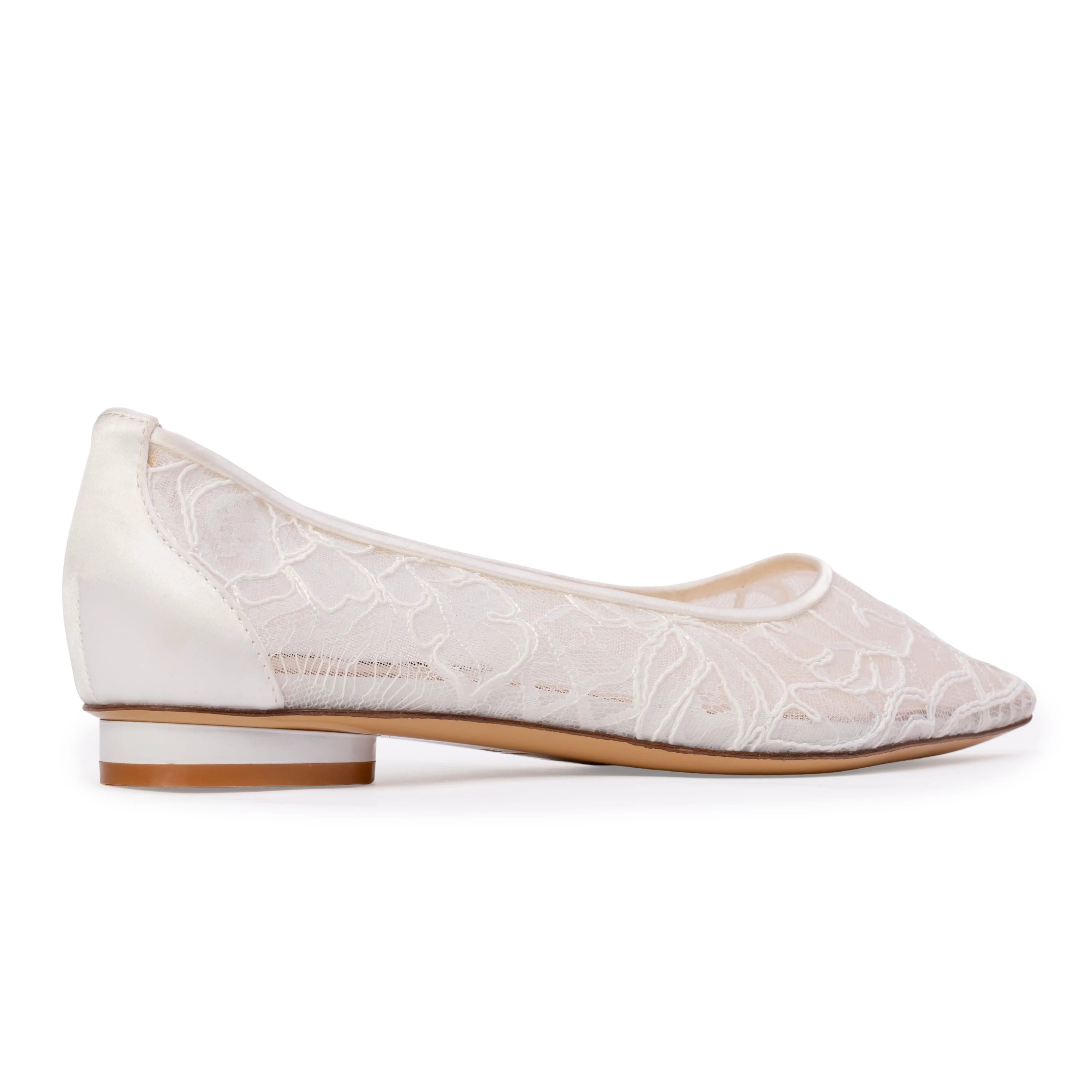 Anne Barge bridal ballerina featuring a pointed toe and minimalist micro-heel, designed with a graceful scooped throatline. Crafted in smooth satin and accented with delicate lace and floral appliqué.
