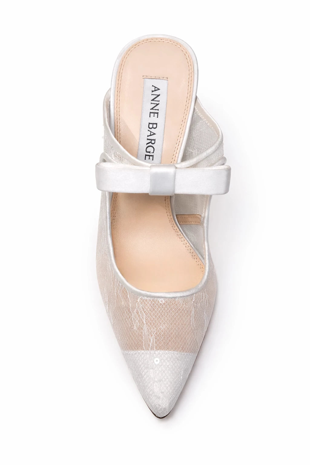 The Anne Barge Luna wedding shoe, is a pointy toe White Sequins Lace slip on pump with a 100 mm heel and a self covered bow, set on a stiletto pin heel.