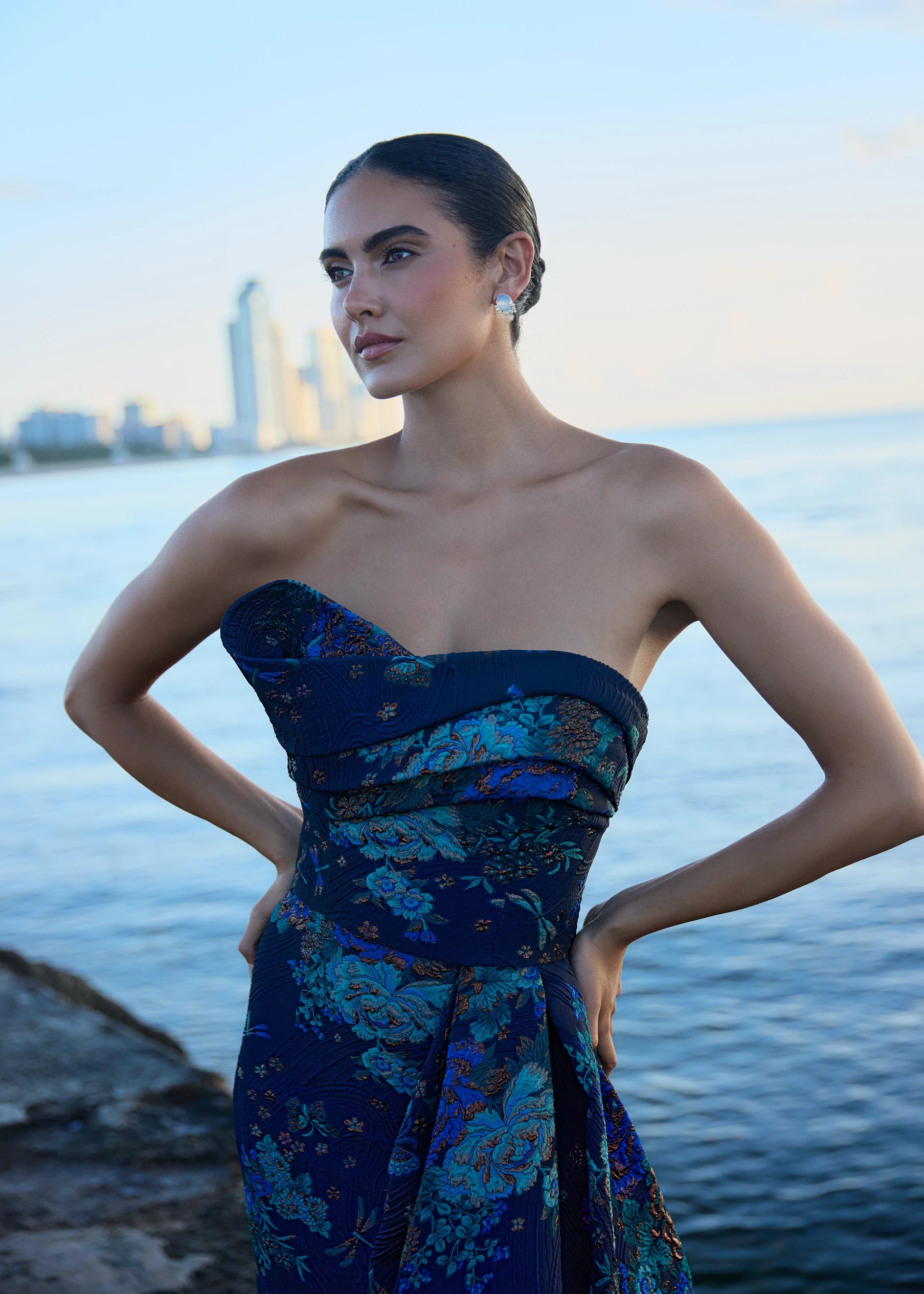 Anne Barge evening gown Mariana, an asymmetrically draped strapless flare gown of Butterfly Blossom Organza Jaquard with side sash.