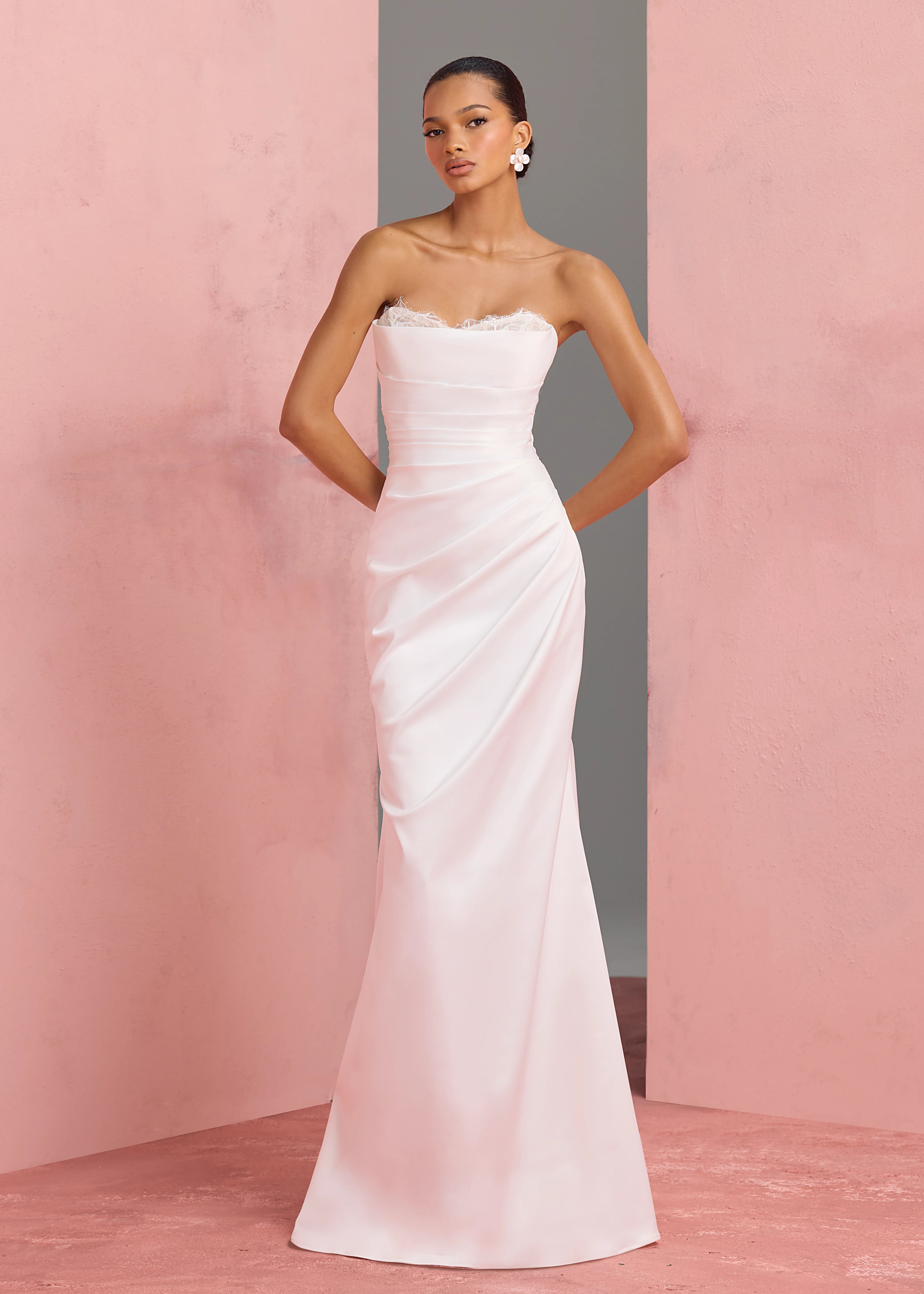 The Marielle gown by Anne Barge is a dramatically draped column gown of Crepe Back Satin featuring a peek-a-boo sweetheart neckline with Petal Beaded Embroidery.