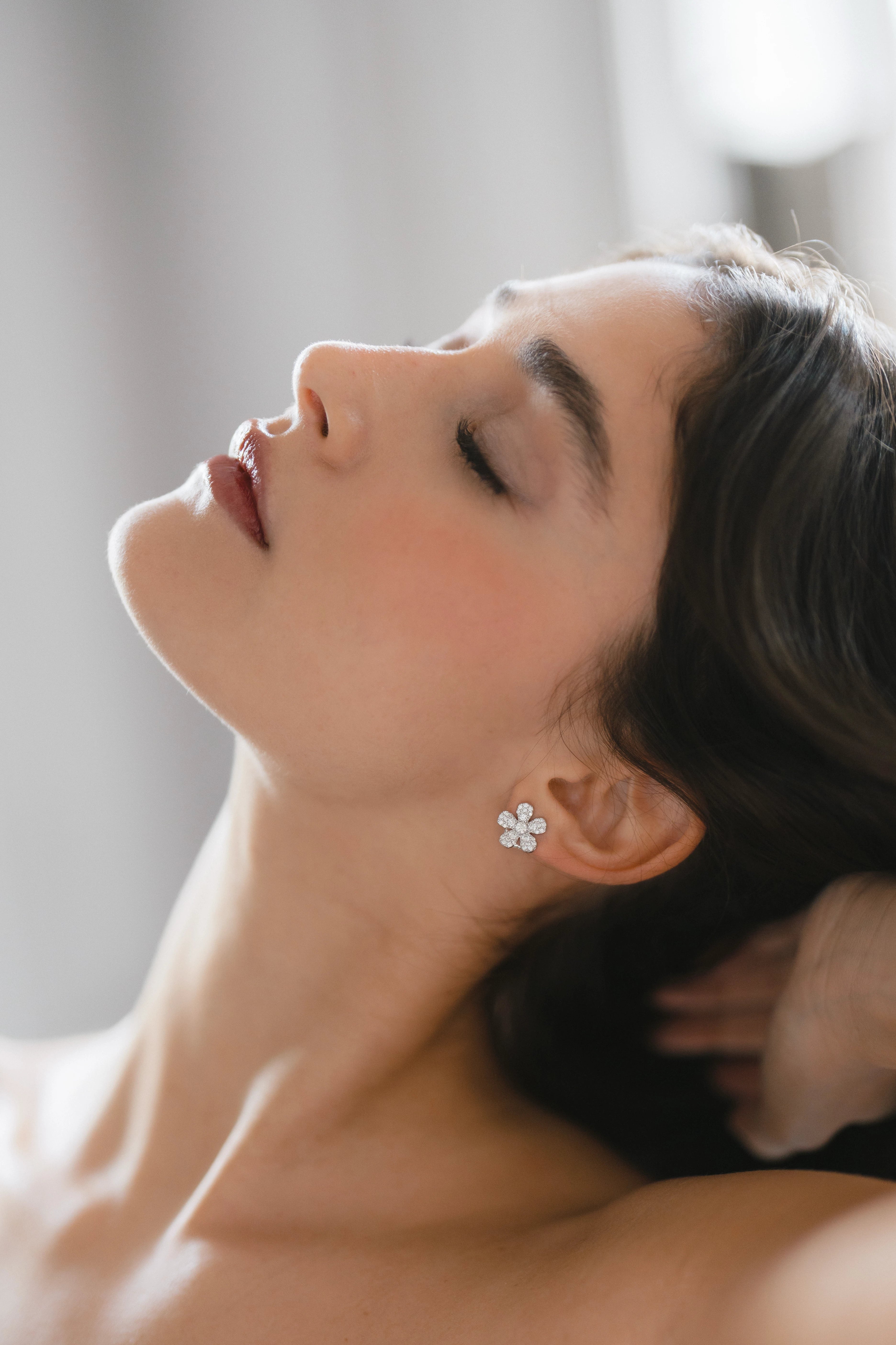 Designed by Atlanta jewelry designer Laura Pearce, delicate pave diamond daisy studs, featuring 0.95 CTTW in brilliant diamonds.