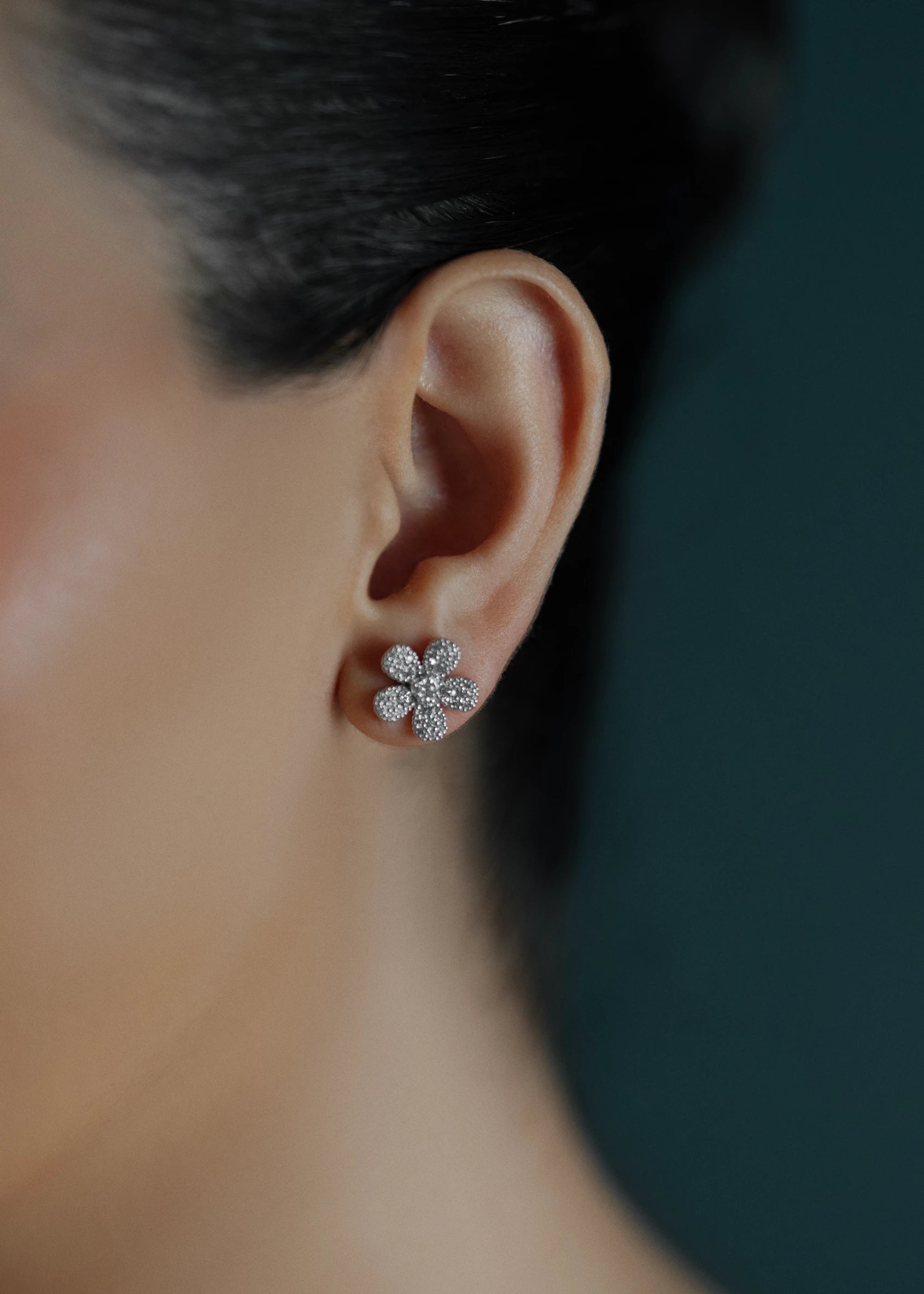 Designed by Atlanta jewelry designer Laura Pearce, delicate pave diamond daisy studs, featuring 0.95 CTTW in brilliant diamonds, and available in 18K Yellow or White Gold.