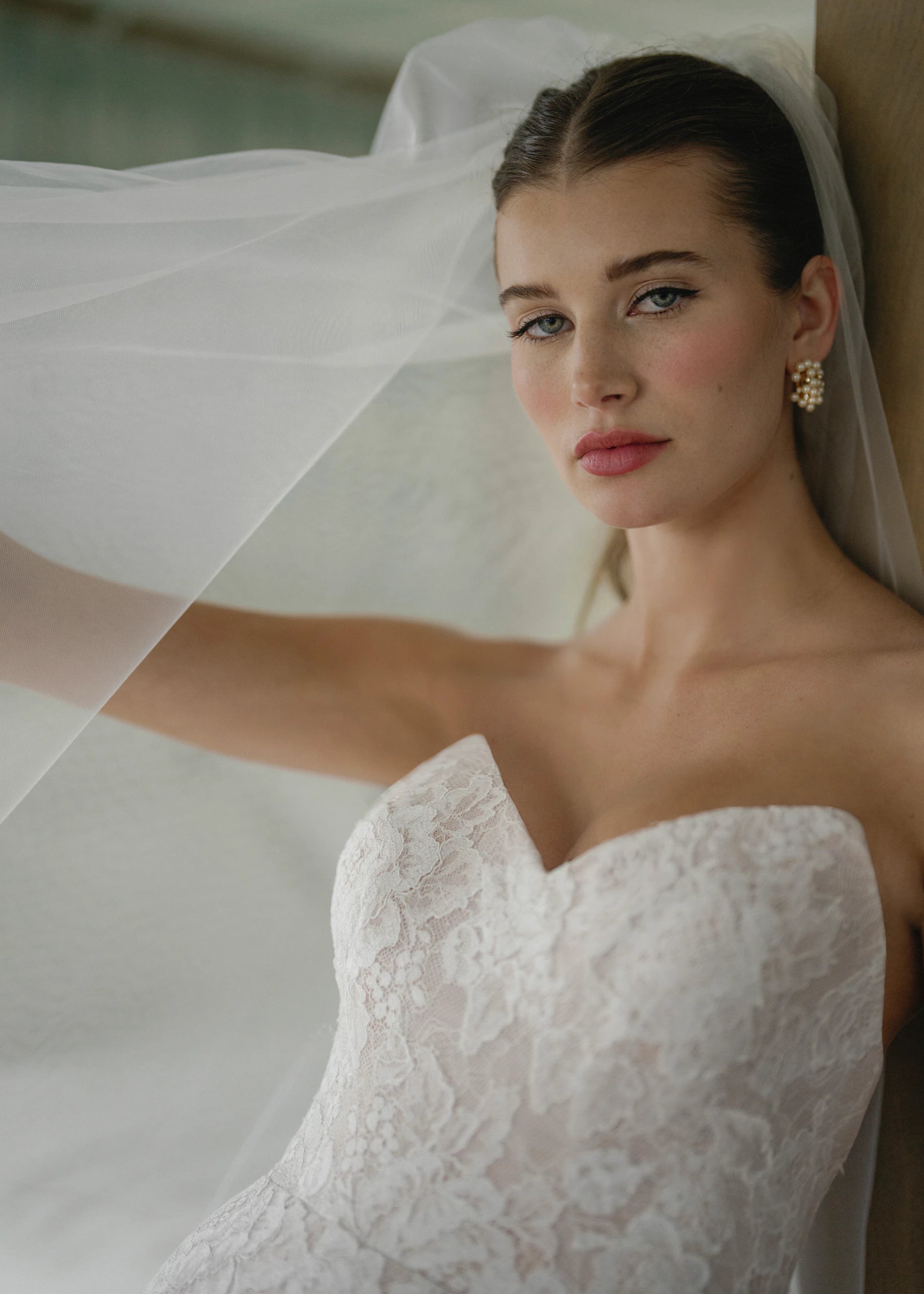 The Pawley gown is a pointed strapless straight gown of Blossom Corded Lace with Chantilly underlay.