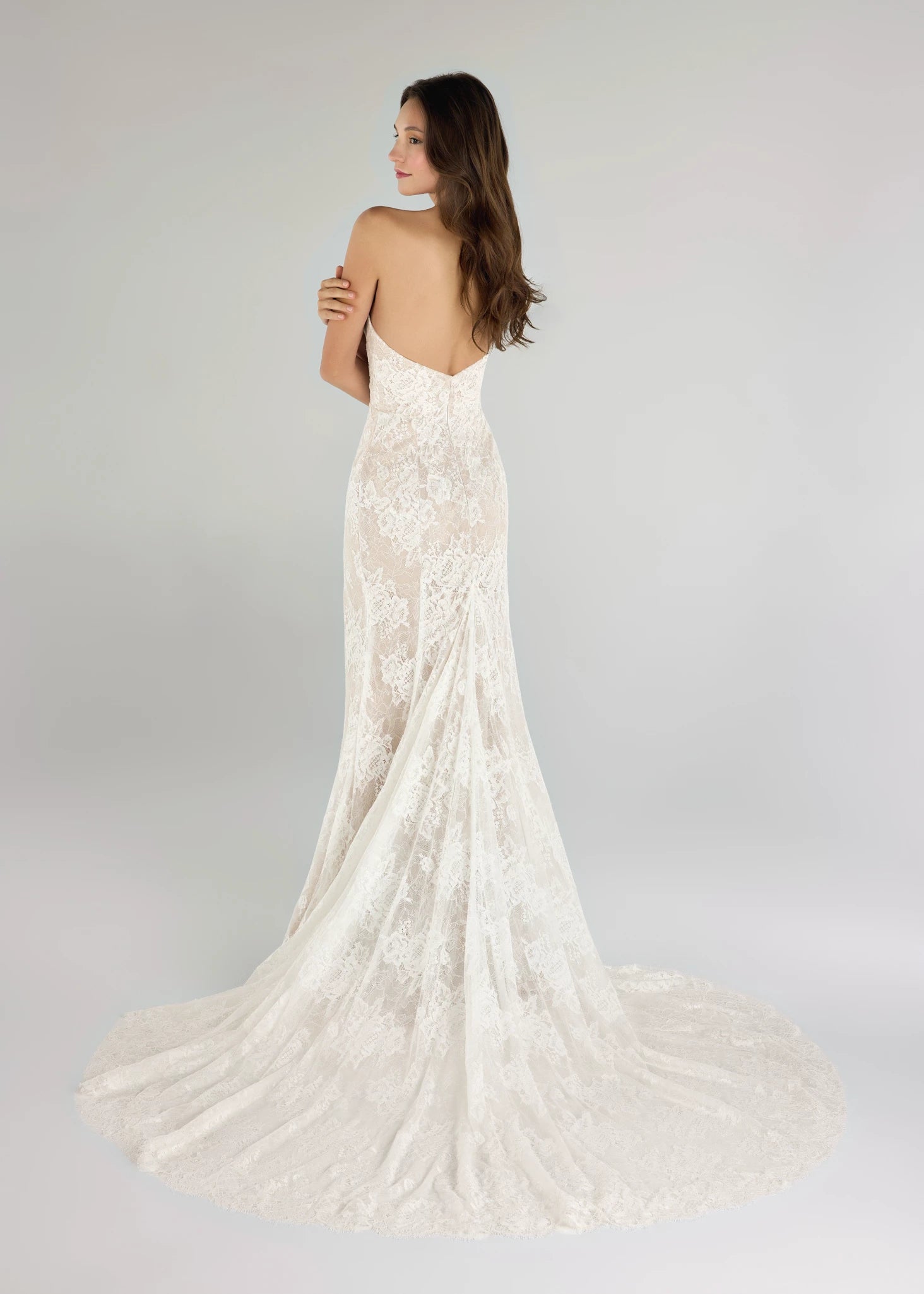 The Pawley gown is a pointed strapless straight gown of Blossom Corded Lace with Chantilly underlay