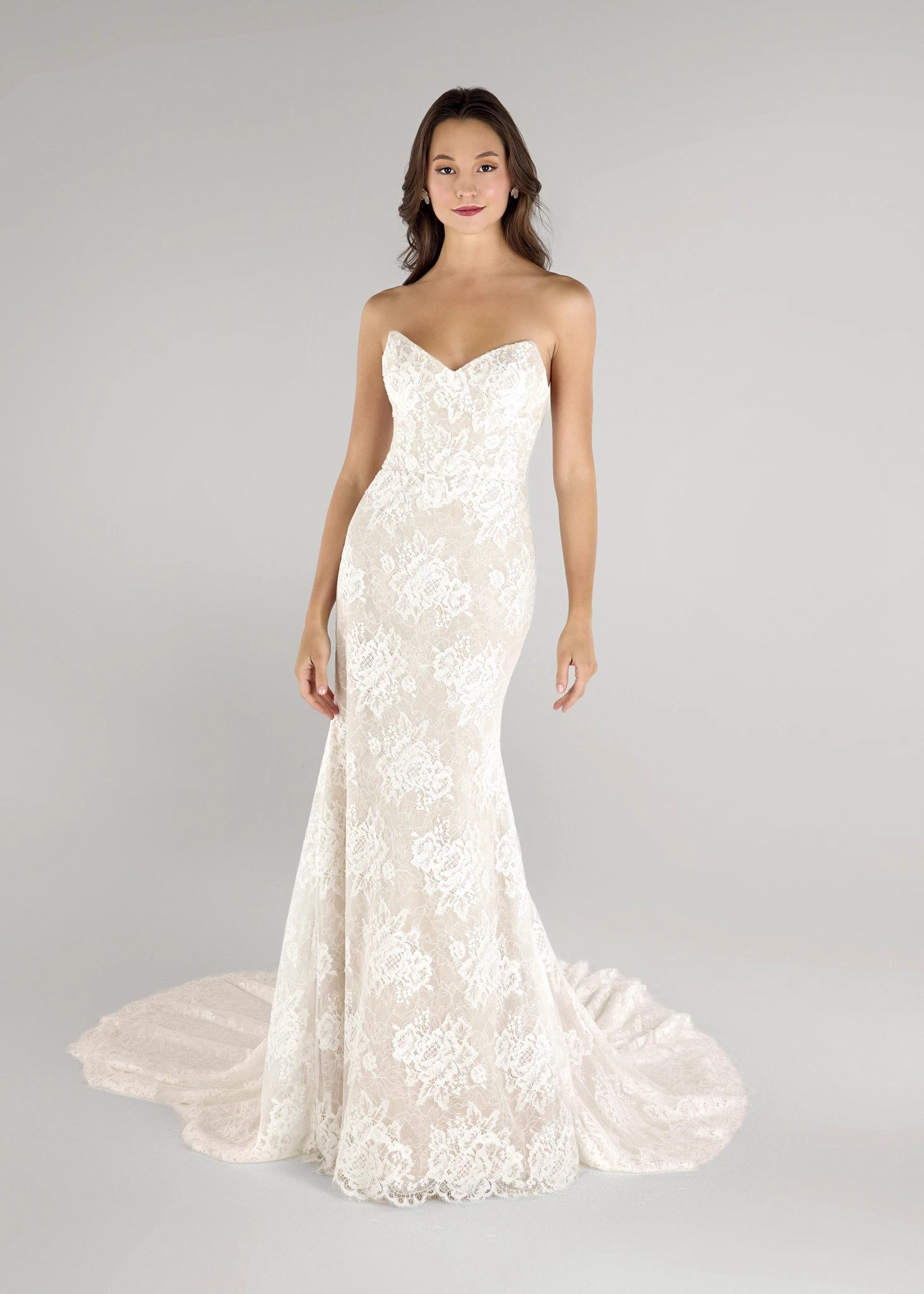 The Pawley gown is a pointed strapless straight gown of Blossom Corded Lace with Chantilly underlay