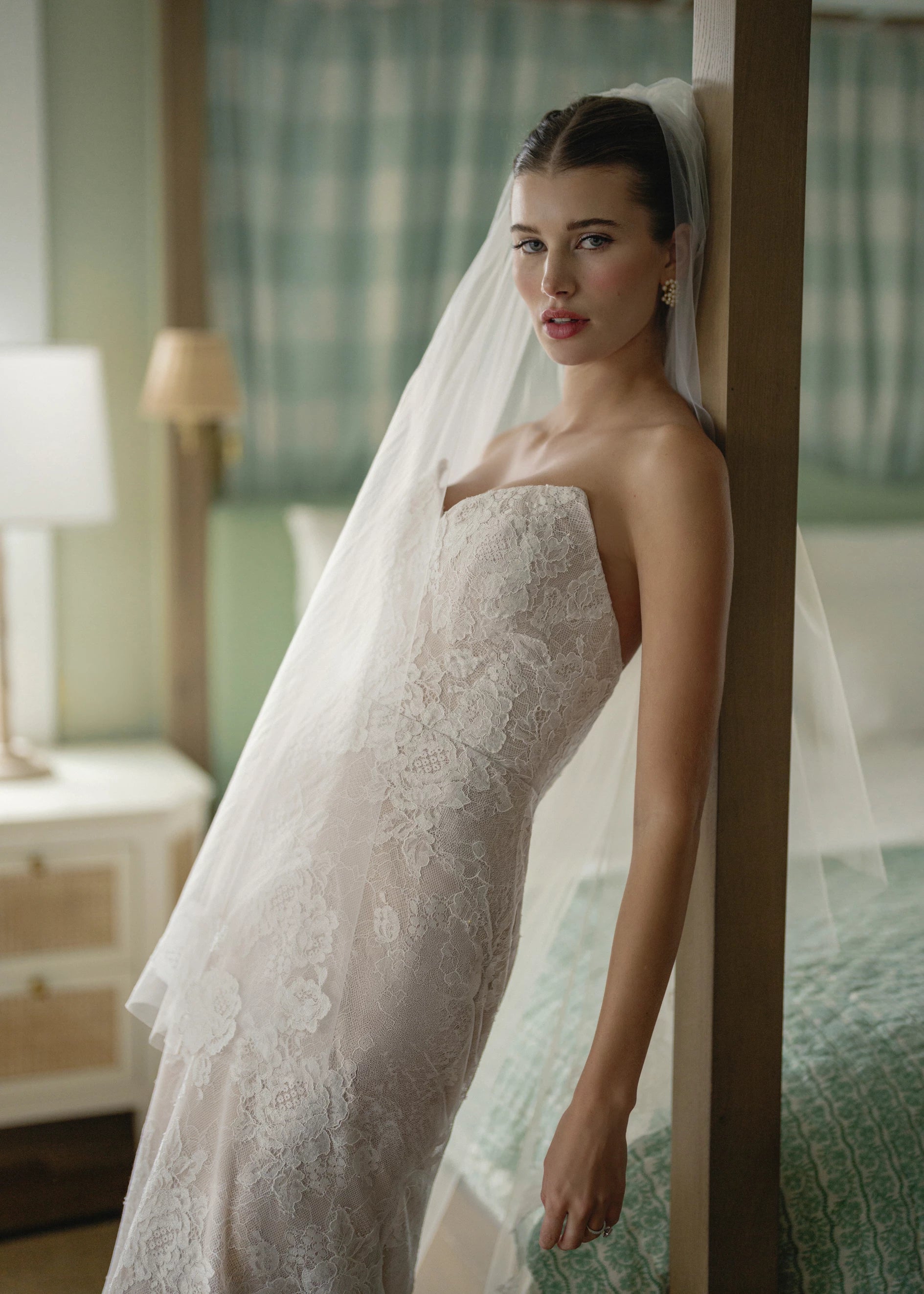 The Blue Willow Pawley Veil is a cathedral length veil with Blossom Corded lace scattered along edge in Silk White.