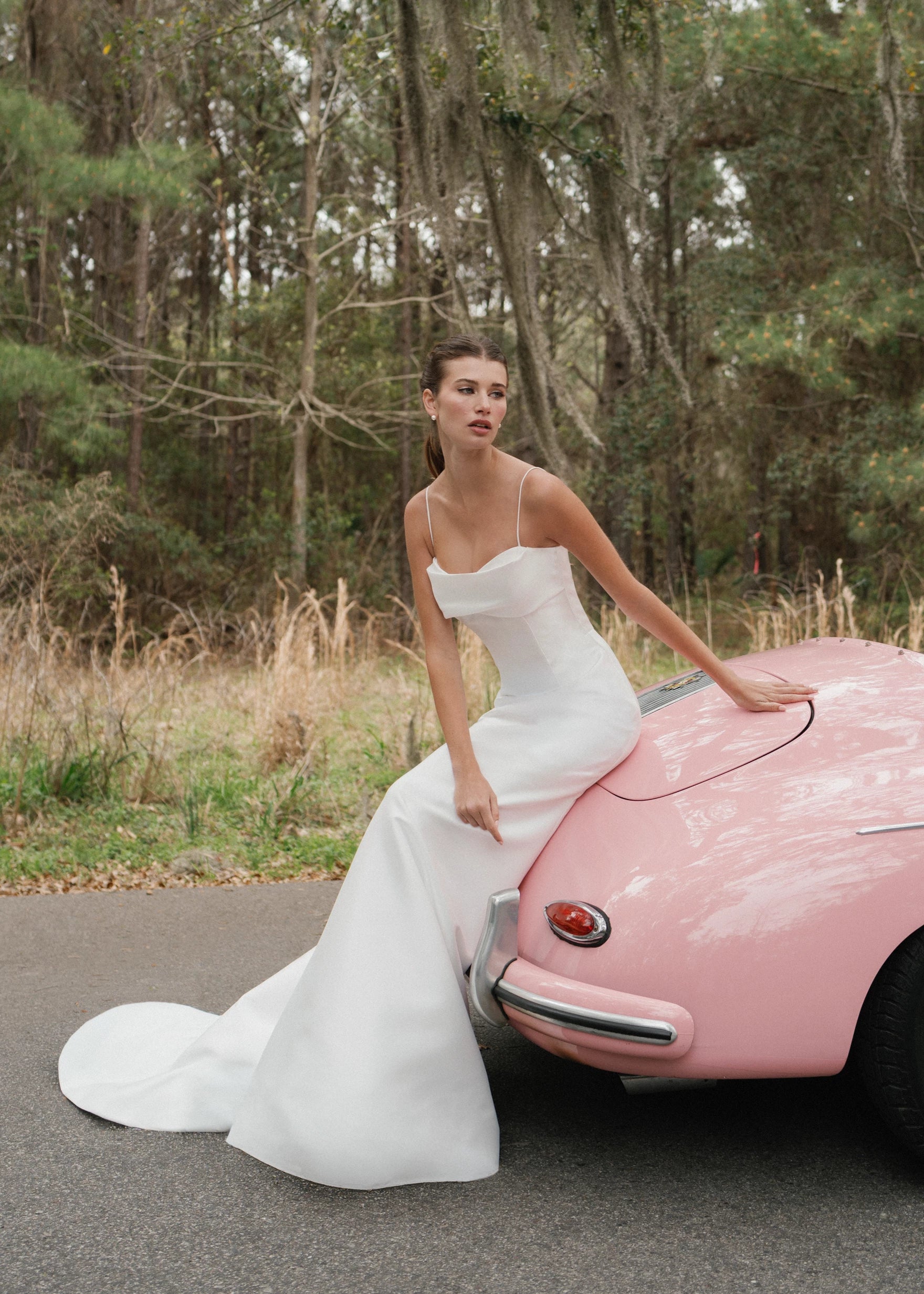The Radcliffe gown is a spaghetti strap fit and flare gown of Soft Mikado with sculpted bodice, asymmetric bodice draping and buttons to the hem.