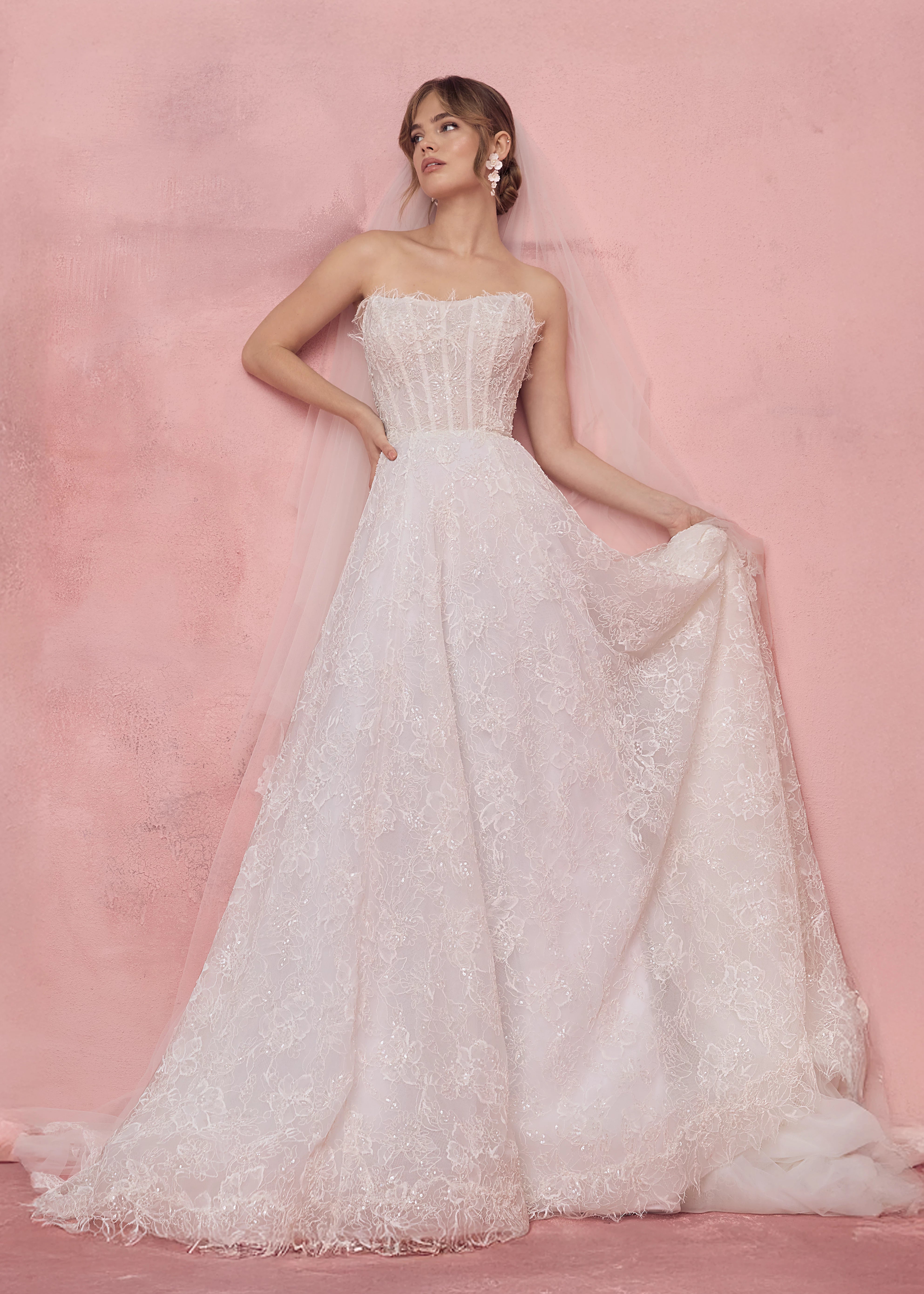 The Sabine gown by Anne Barge is a scoop neck strapless collapsed A-line gown of Petal Beaded Embroidery.