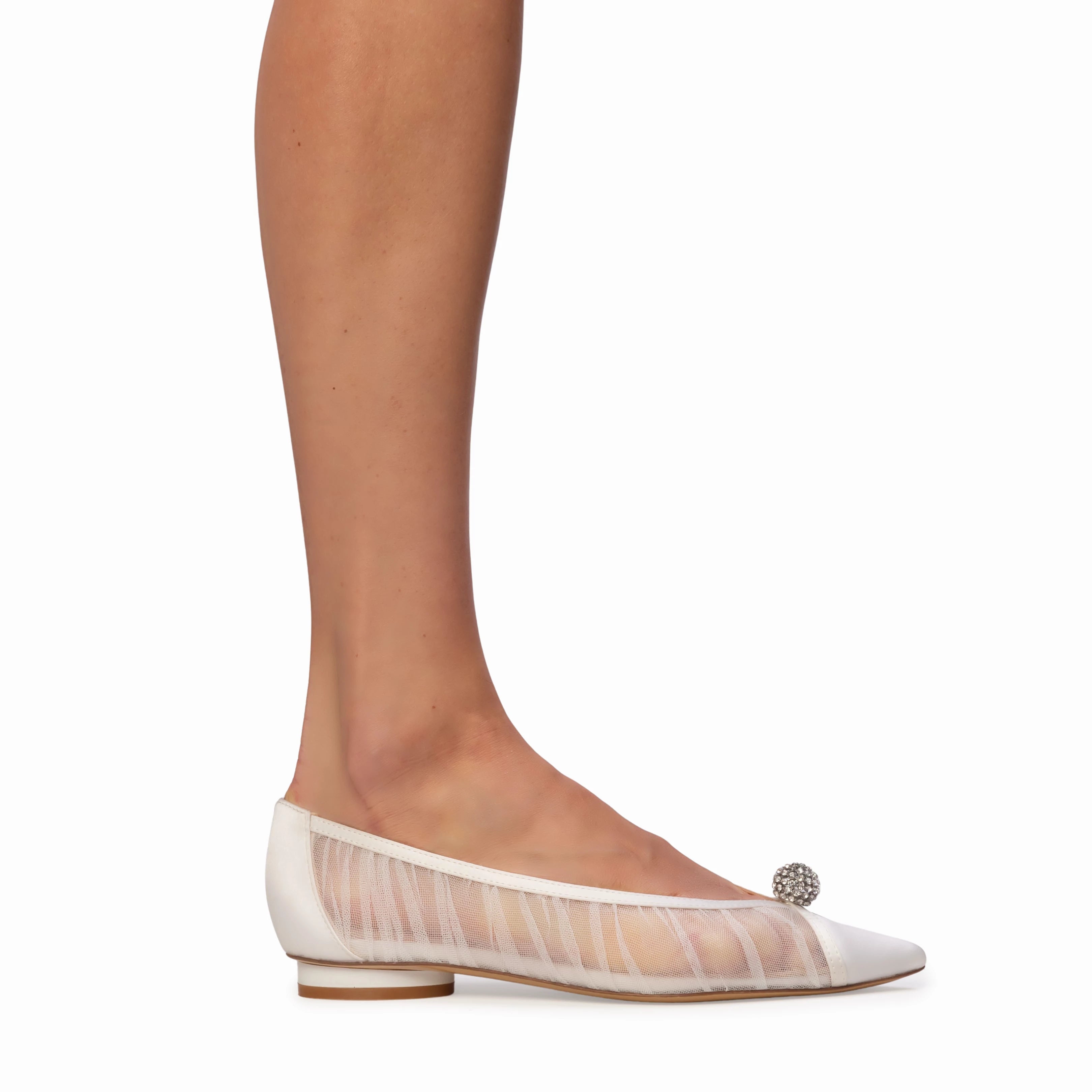 The Anne Barge Sabine wedding shoe, is a pointy toe flat with White Tulle ruching and embellished ball detail, set on a micro heel.