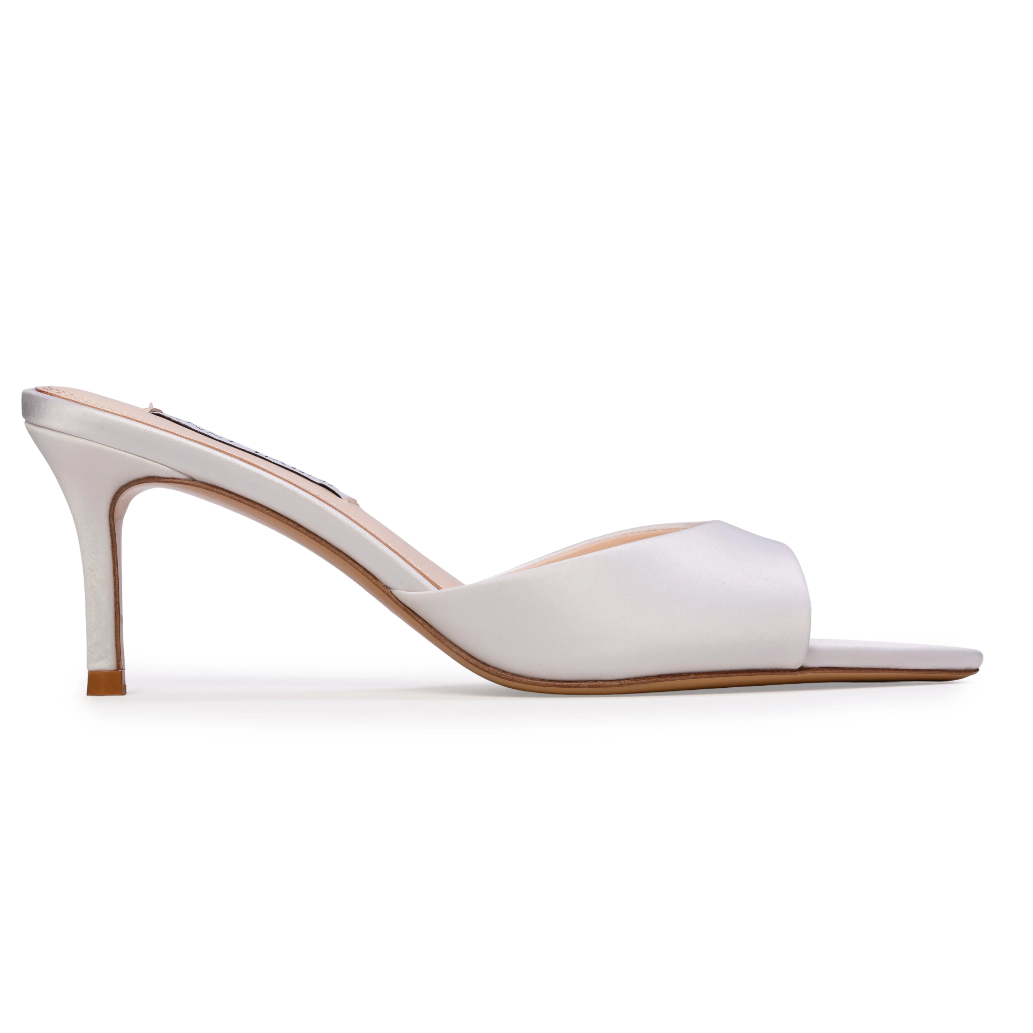 The Anne Barge Serenity wedding shoe, is a pointy toe classic slip on mule, set on a mid 70 mm straight heel available in White Satin and White Flower Silk.