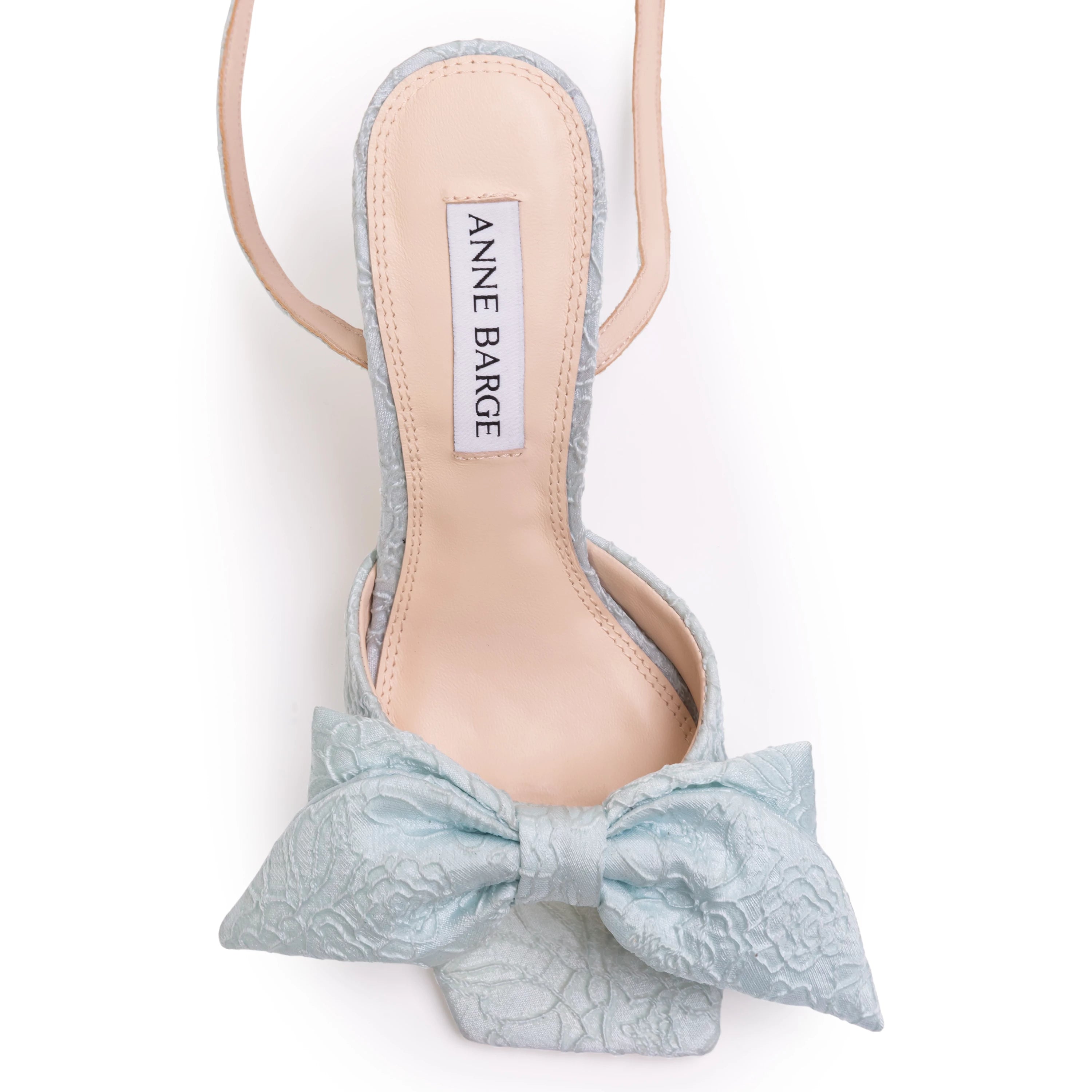 crystal-embellished square buckle and a softly draped bow detail across the upper. Crafted from luxurious satin jacquard.