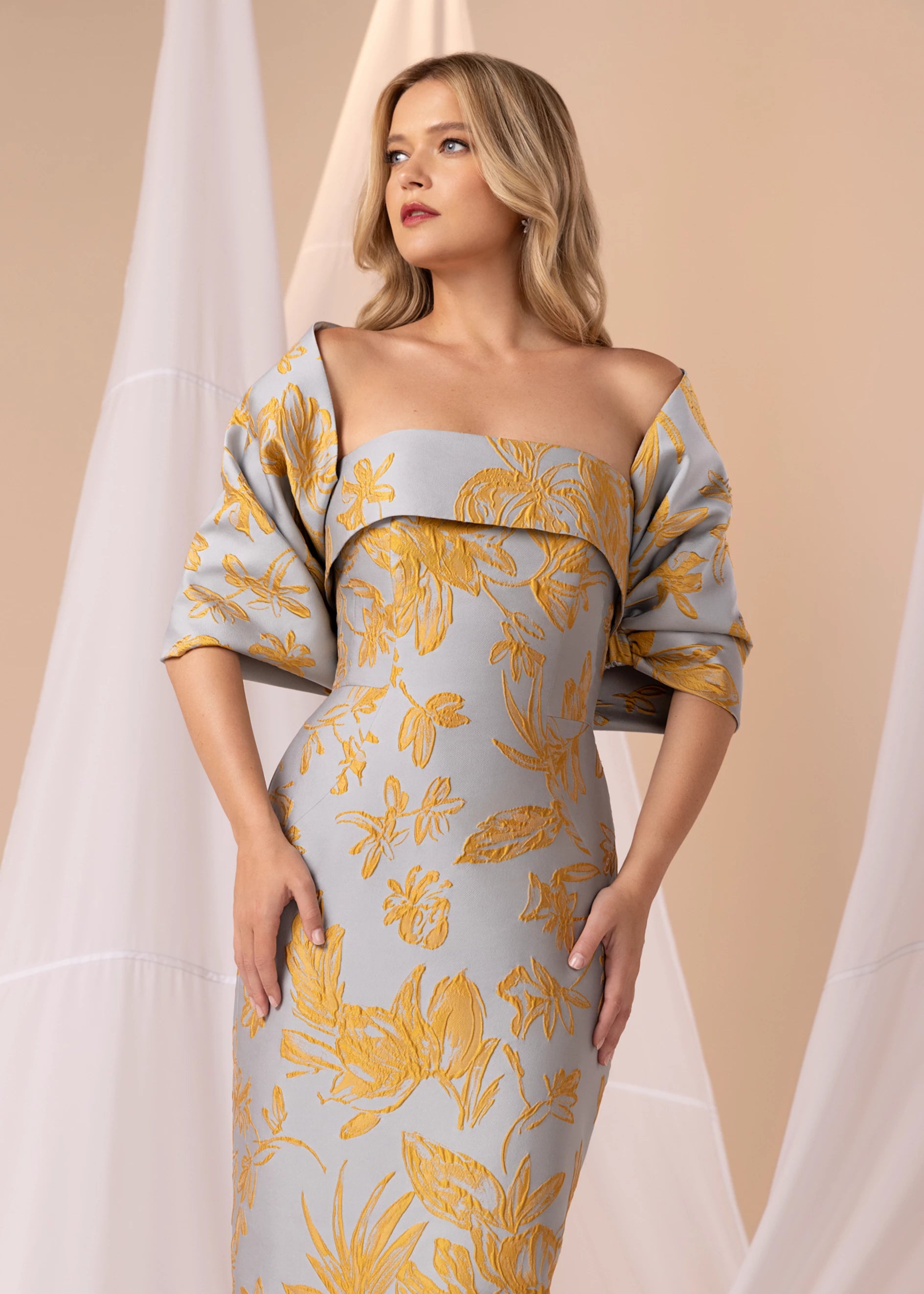 The Bryn Wrap from Black Label by Anne Barge is an elastic wrap in Floating Floral Jacquard meant to be worn over or off-the-shoulder