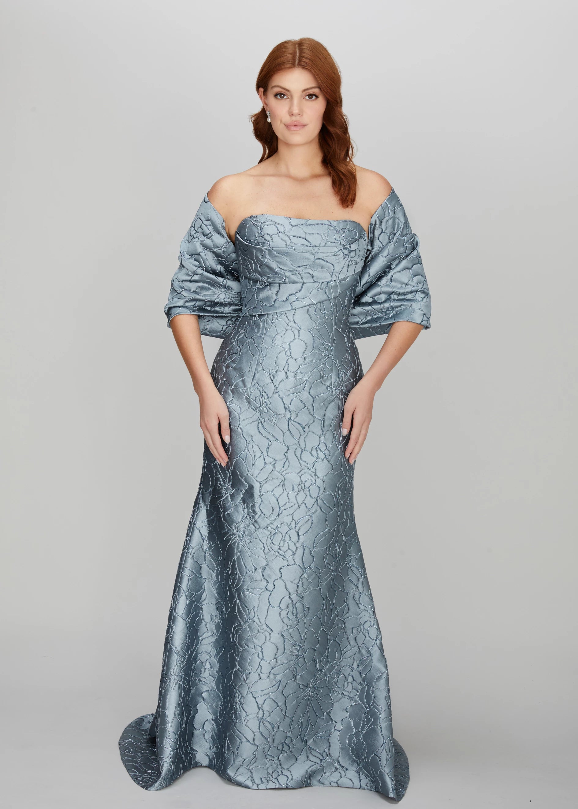 The Bryn Wrap from Black Label by Anne Barge is an elastic wrap in Jacquard Floral Lamé meant to be worn over or off-the-shoulder