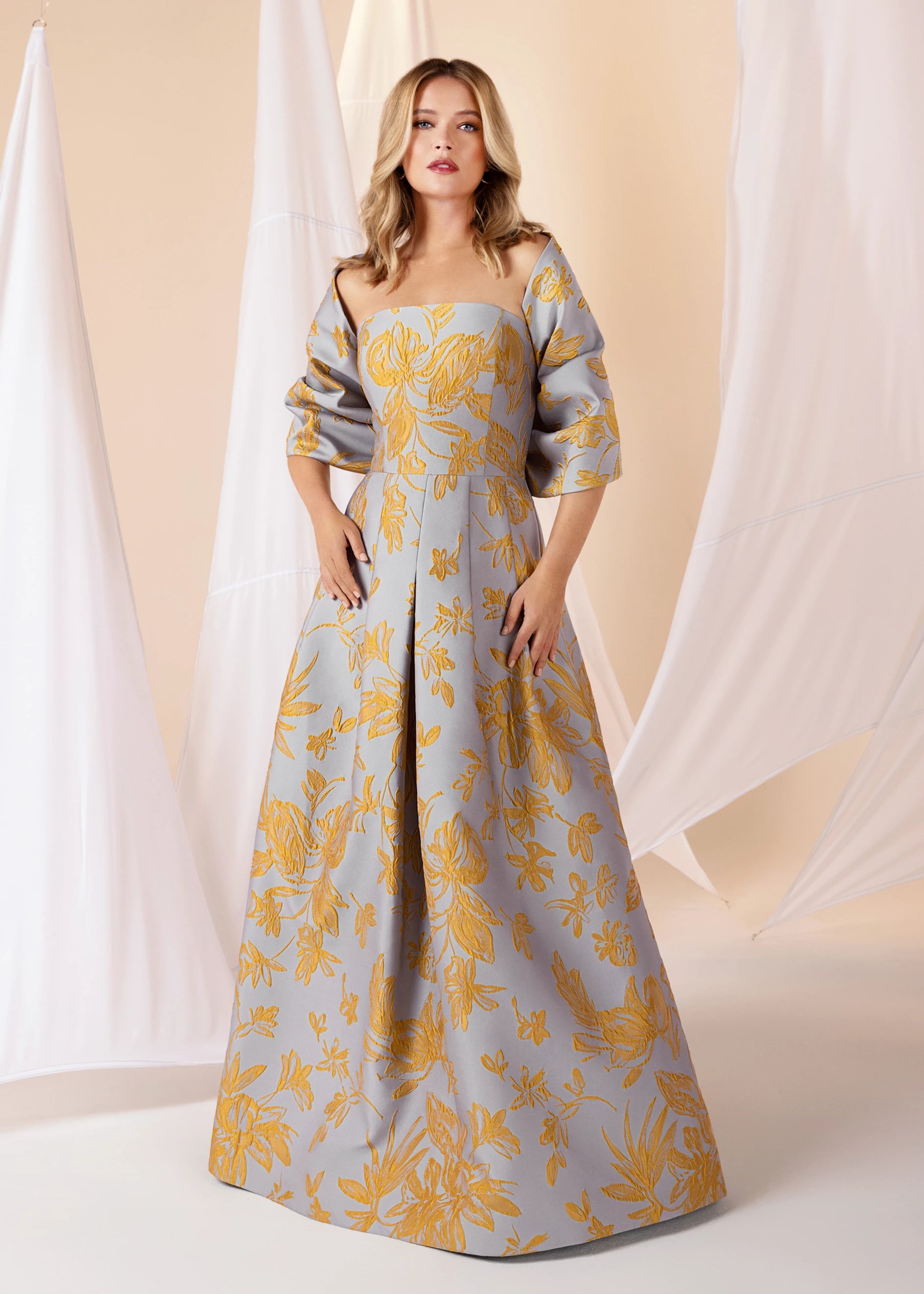The Bryn Wrap from Black Label by Anne Barge is an elastic wrap in Floating Floral Jacquard meant to be worn over or off-the-shoulder