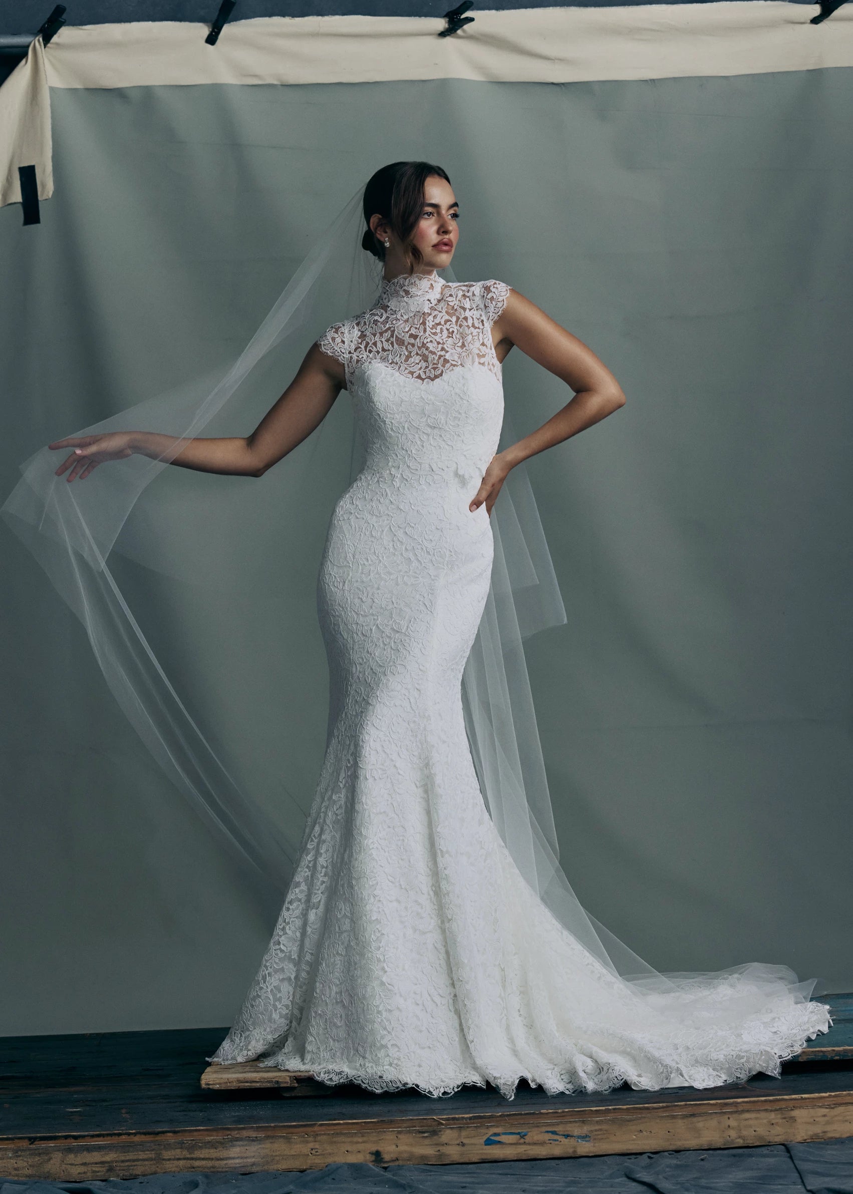 The Anouk gown paired with the Anouk Top, a mockneck cap sleeve topper of Corded Scrolling Floral Lace. 