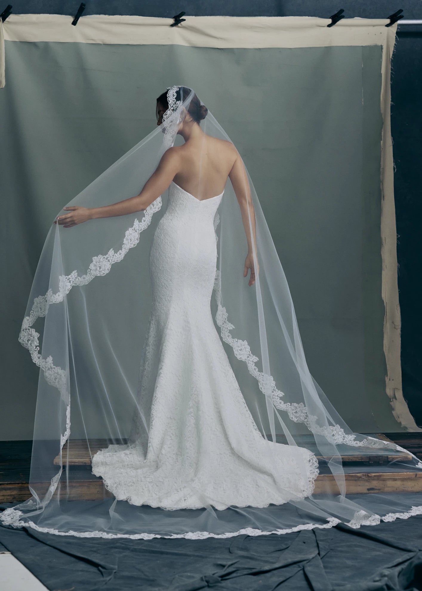Back view of the The Anouk veil, a mantilla veil with Corded Scrolling Floral Lace border in Silk White. 