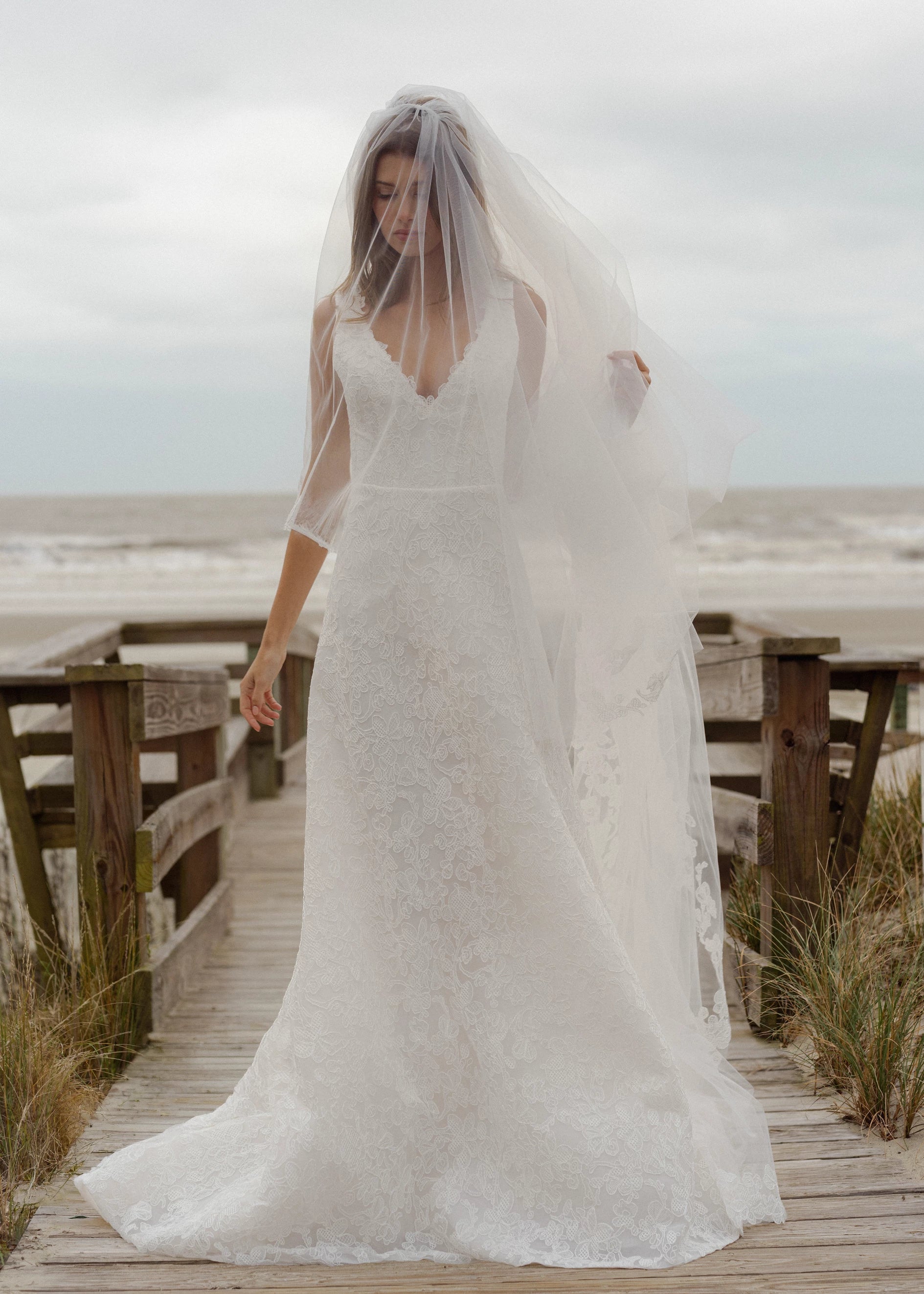 The Blue Willow Ashley Veil is a cathedral veil with a Scrollwork Embroidery edge in Pearl.
