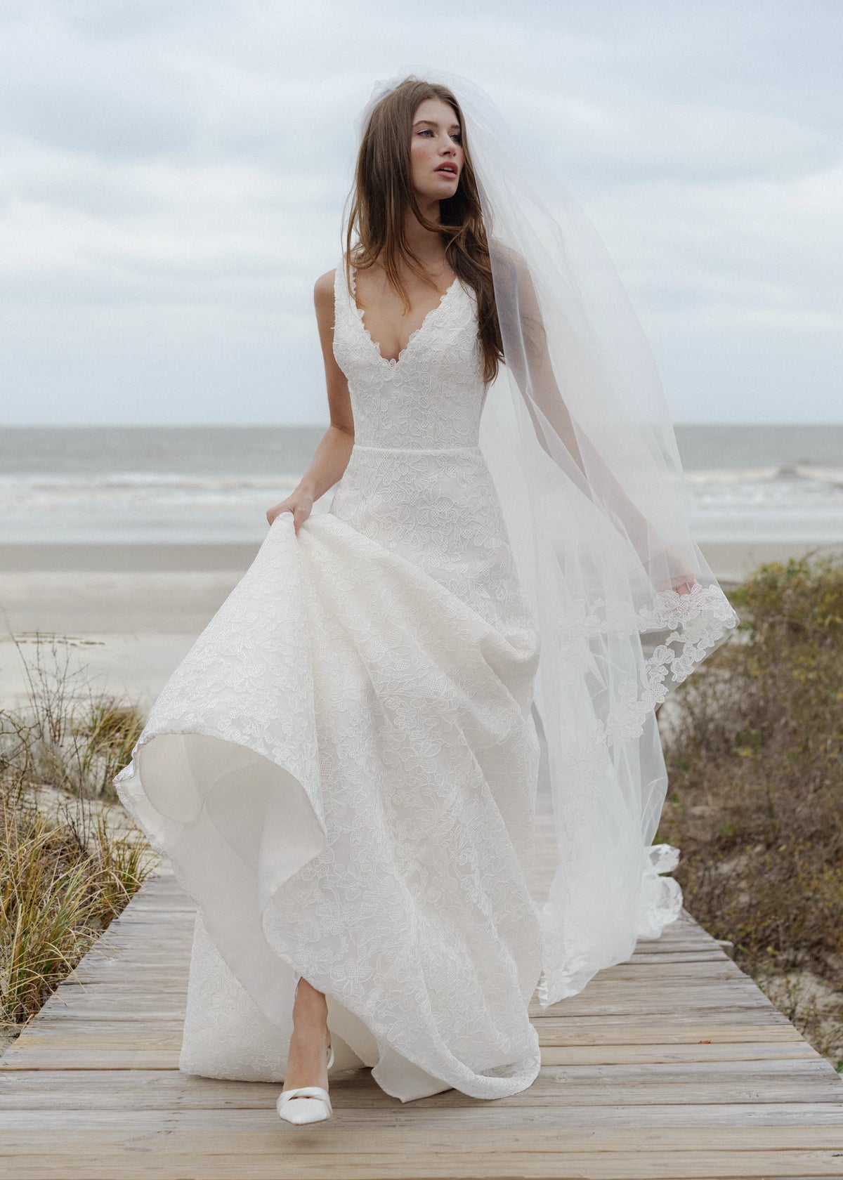 The Blue Willow Ashley Veil is a cathedral veil with a Scrollwork Embroidery edge in Pearl.