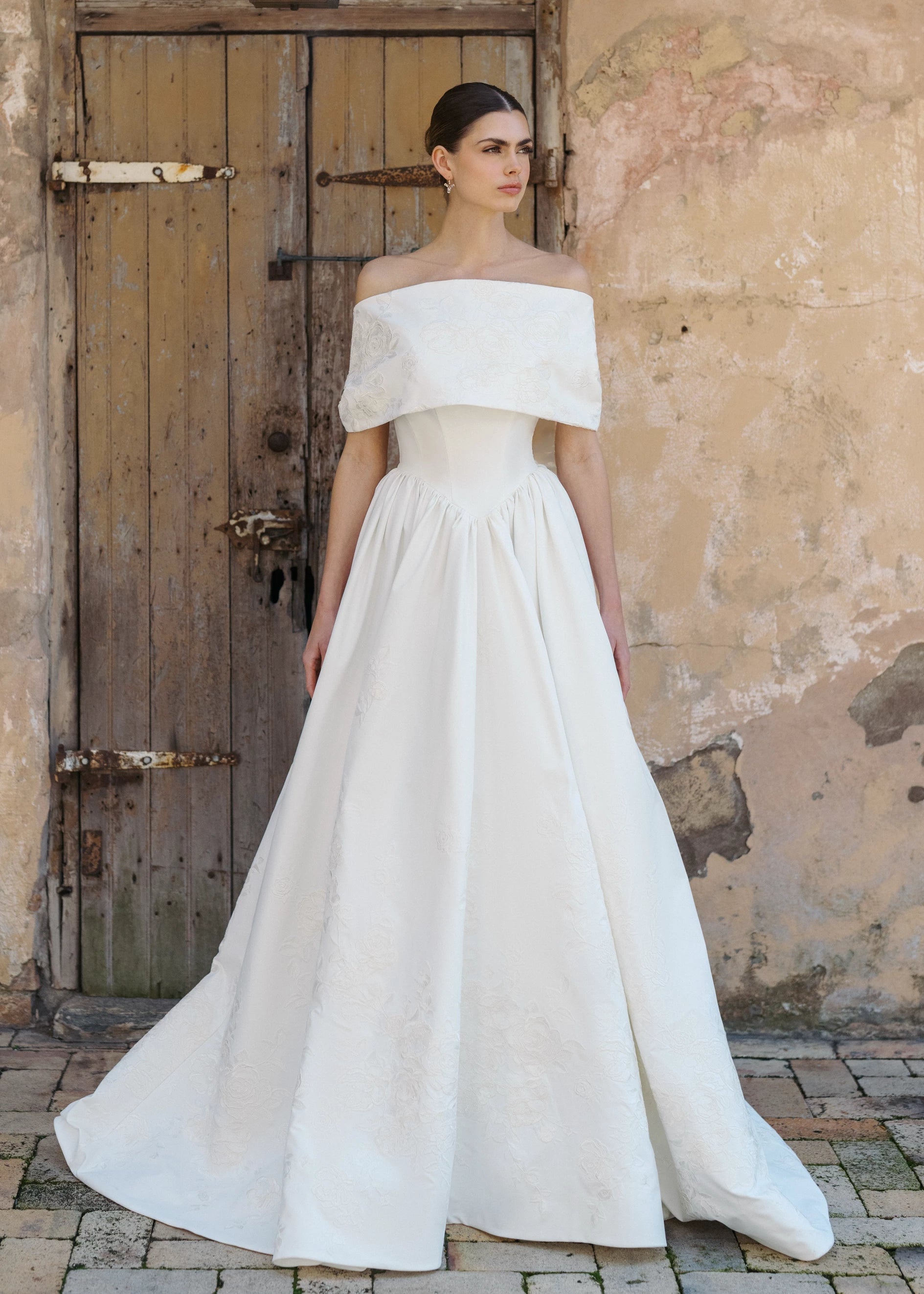 The Blue Willow St. Charles Wrap is an origami style wrap of Embroidered Satin in Silk White.