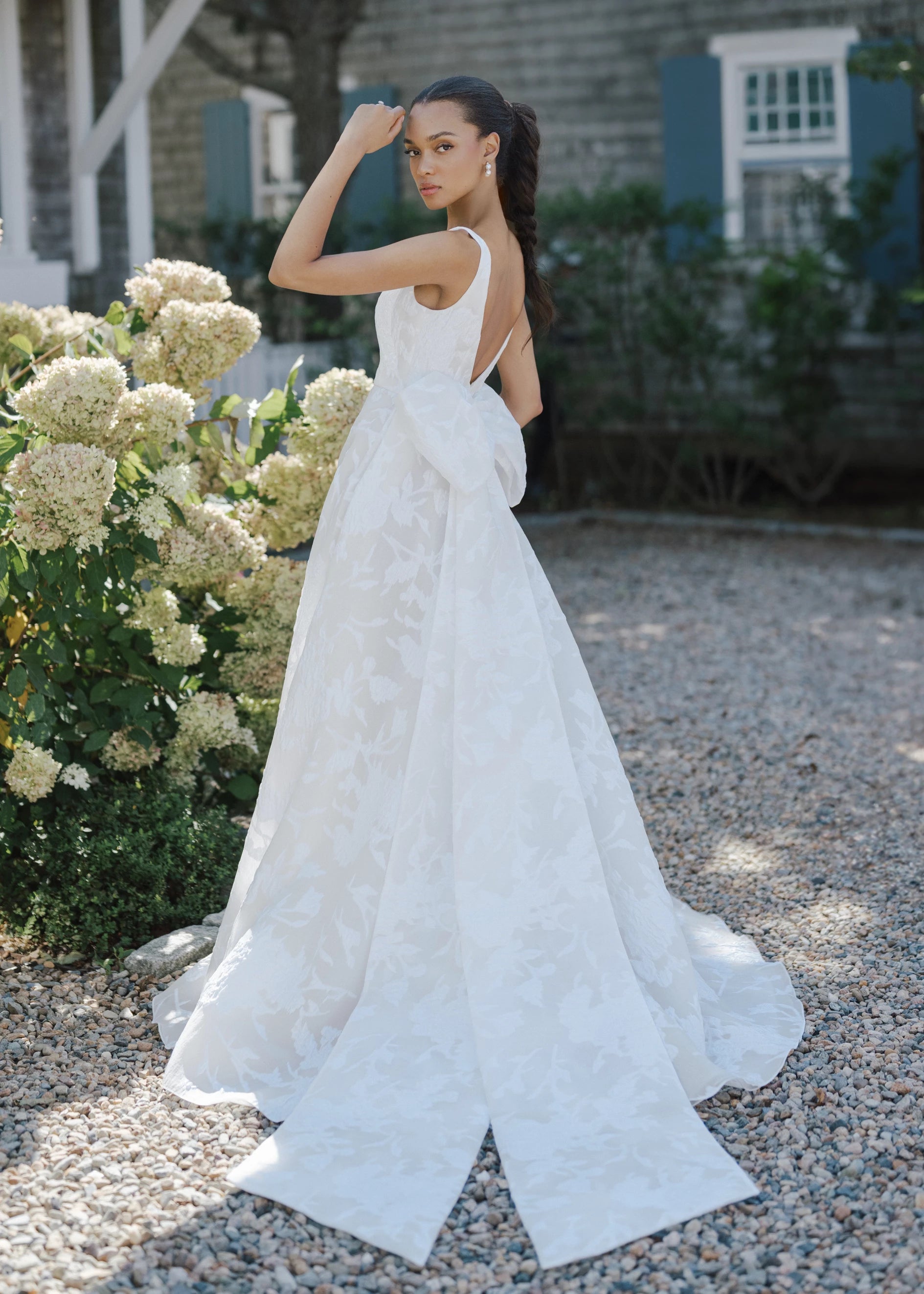 The Blue Willow Liberty Bow is a dramatic oversized symmetrical bow of Floral Jacquard Burnout Organza with streamers in Silk White.