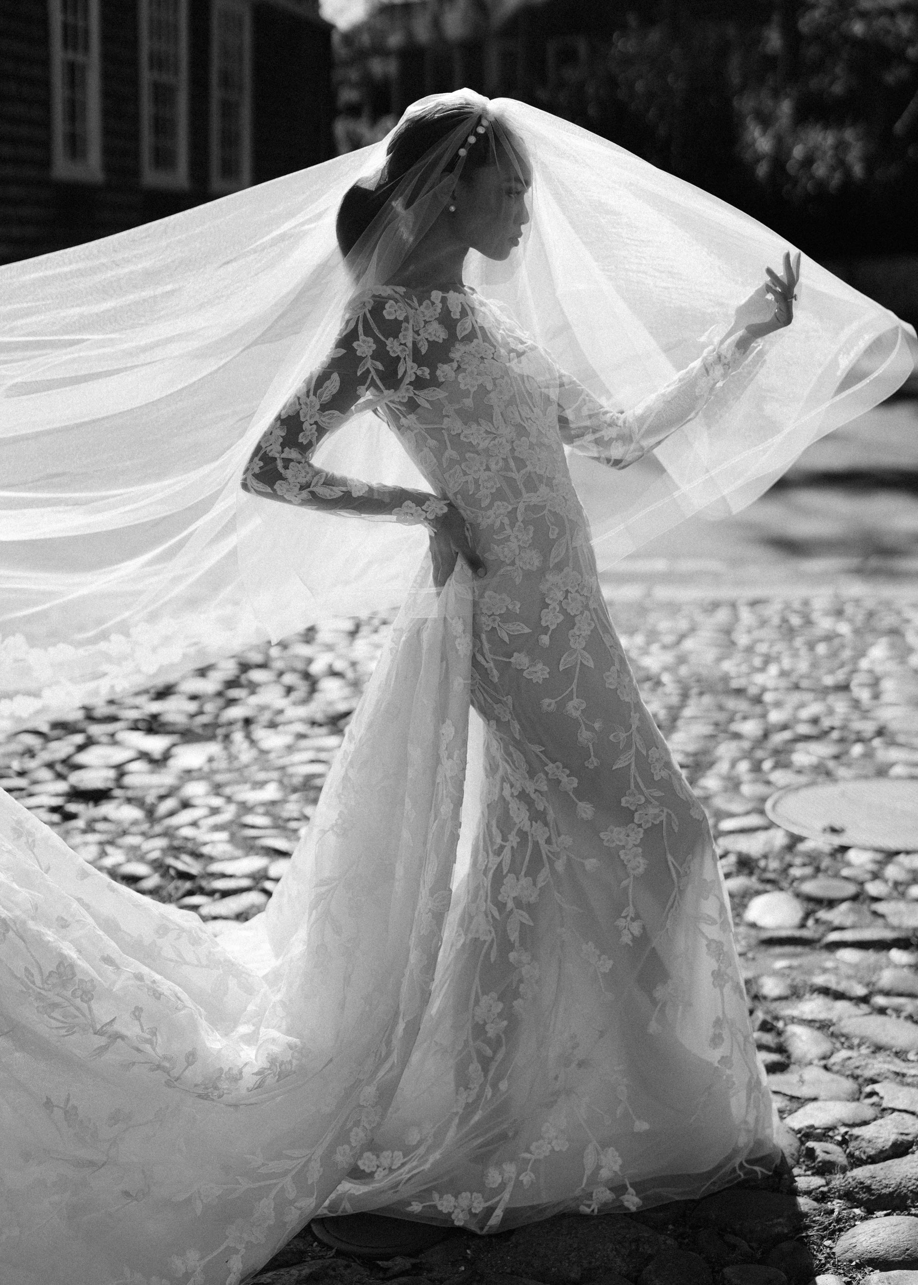 The Millie Train is a striking box pleated detachable train with allover Floral Threadwork Embroidery in Silk White/Nude.