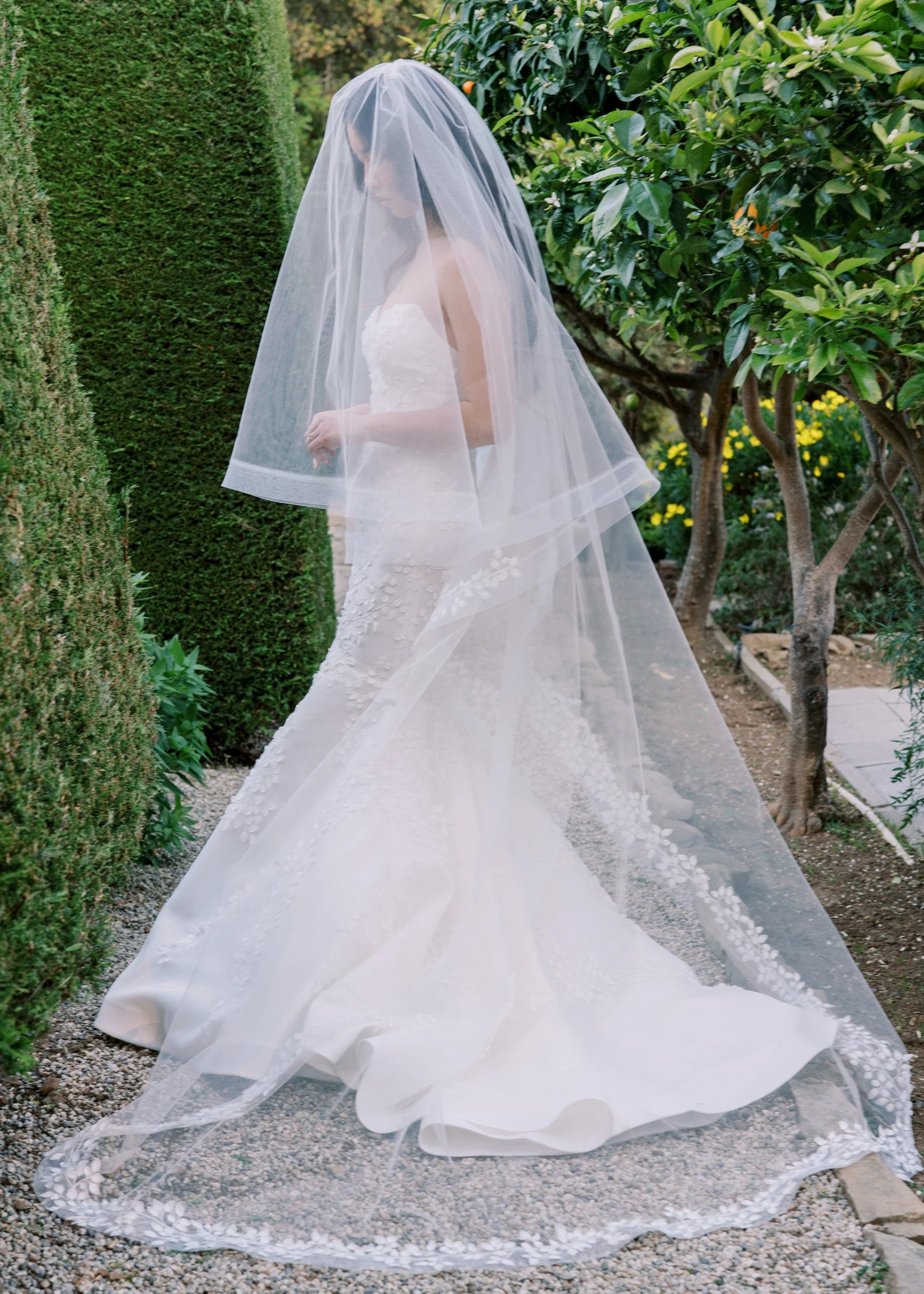A strapless sweetheart mermaid gown with 3D leaf embroidery