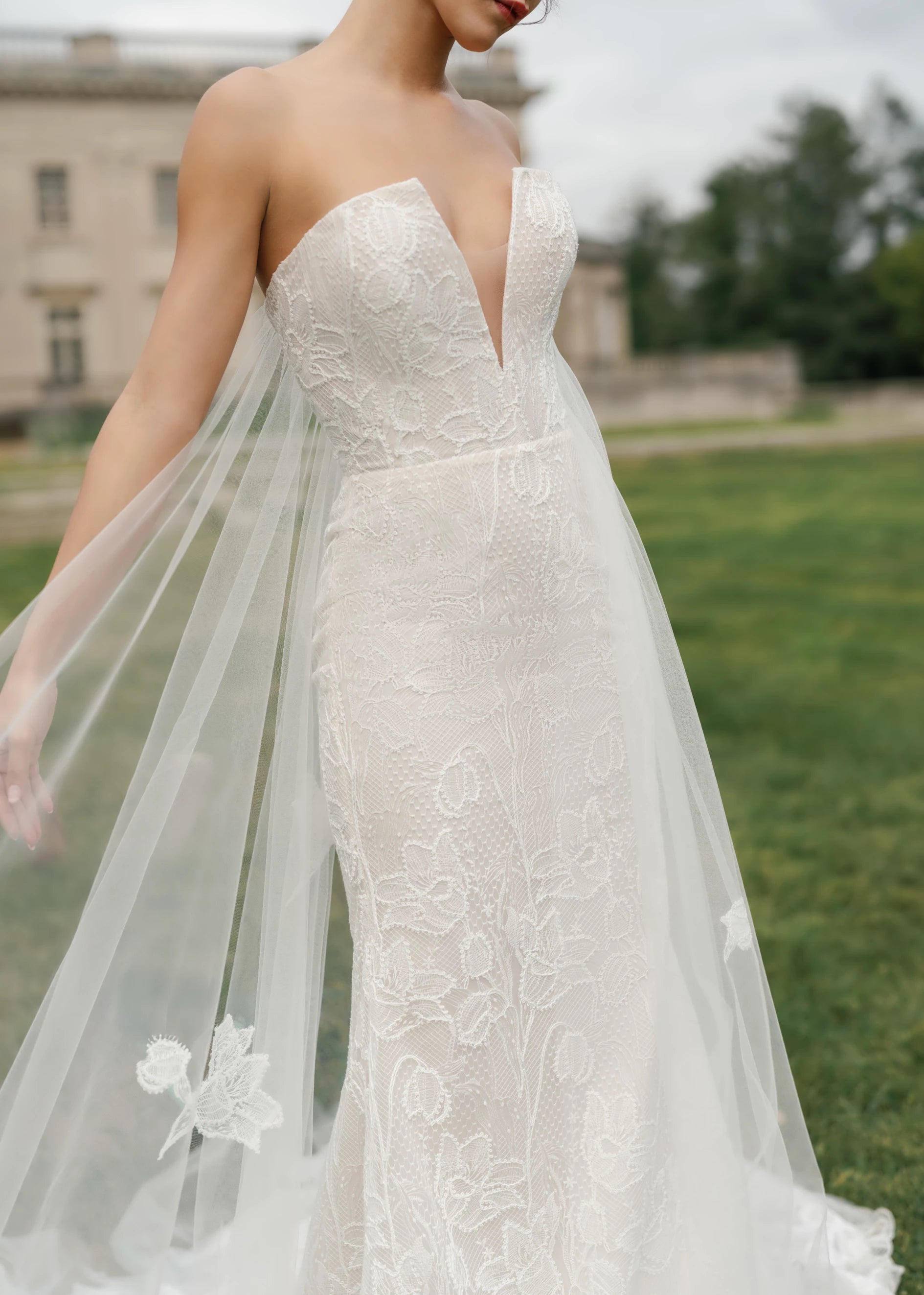 The Blue Willow Wyncote Watteau Train is a detachable Illusion tulle watteau train with Crochet Lace appliqués in Silk White.
