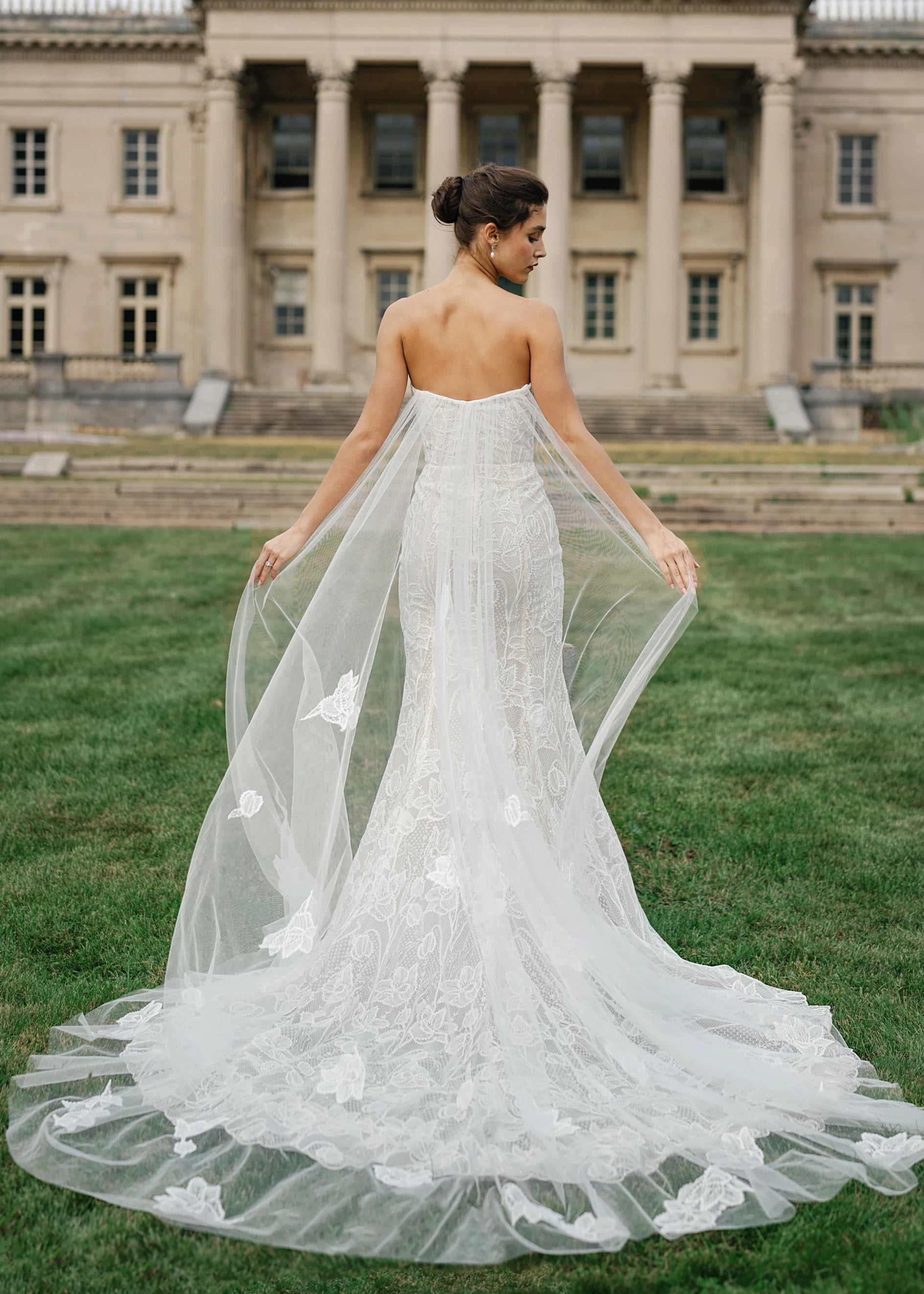 The Blue Willow Wyncote Watteau Train is a detachable Illusion tulle watteau train with Crochet Lace appliqués in Silk White. 