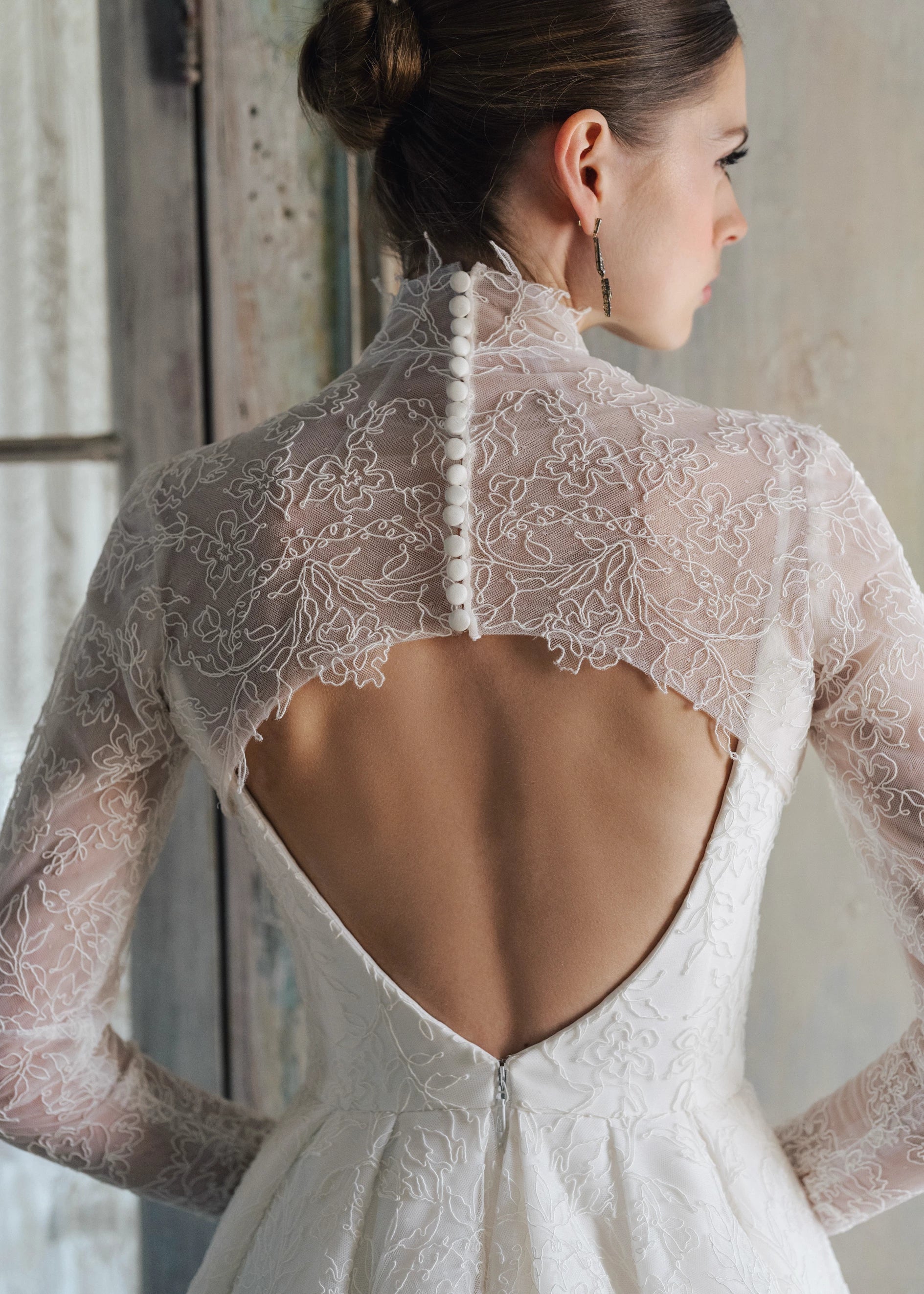 The Blue Willow Brennan Topper is a keyhole illusion tulle topper of Corded Lace with mockneck.