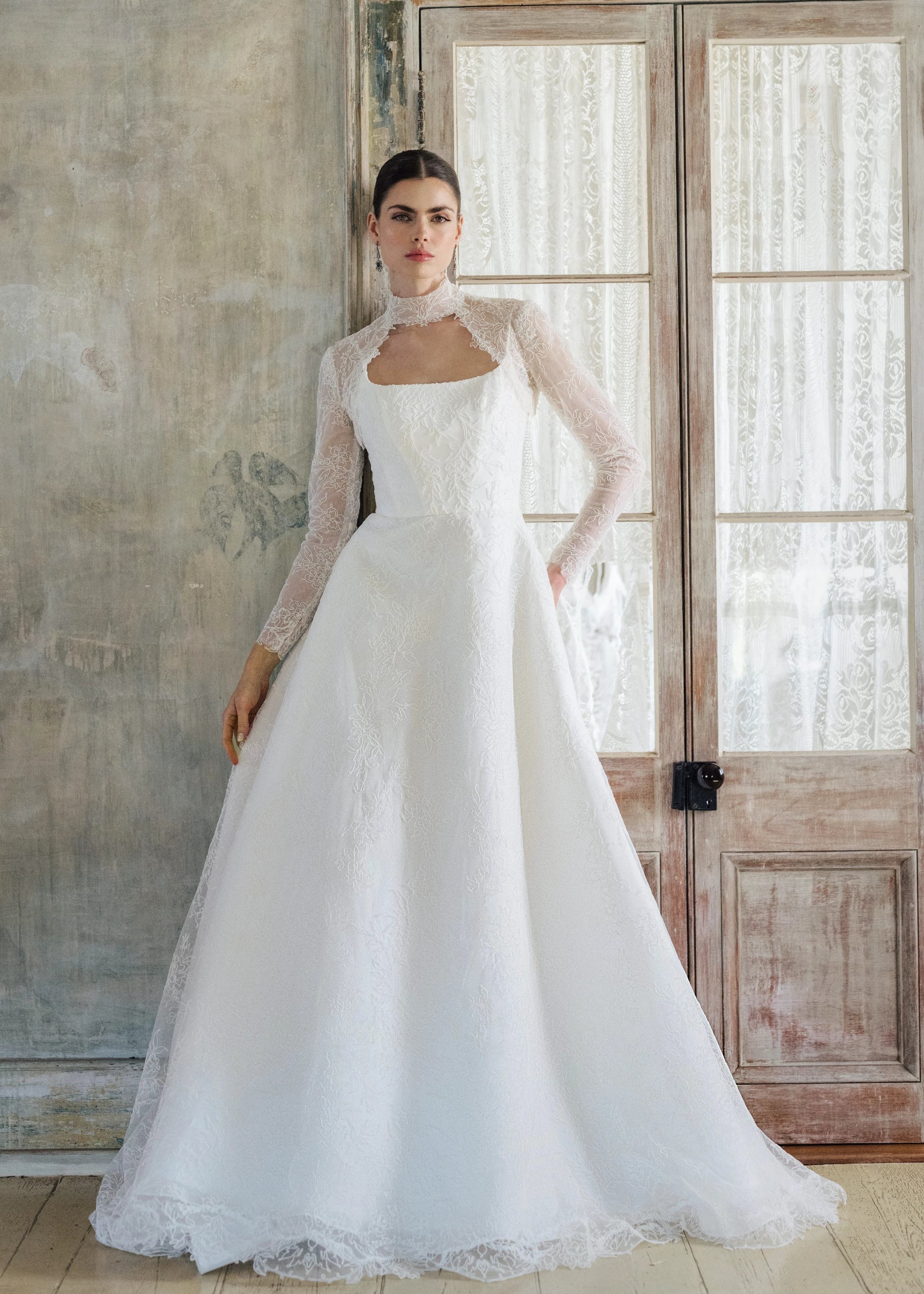 The Blue Willow Brennan Topper is a keyhole illusion tulle topper of Corded Lace with mockneck.