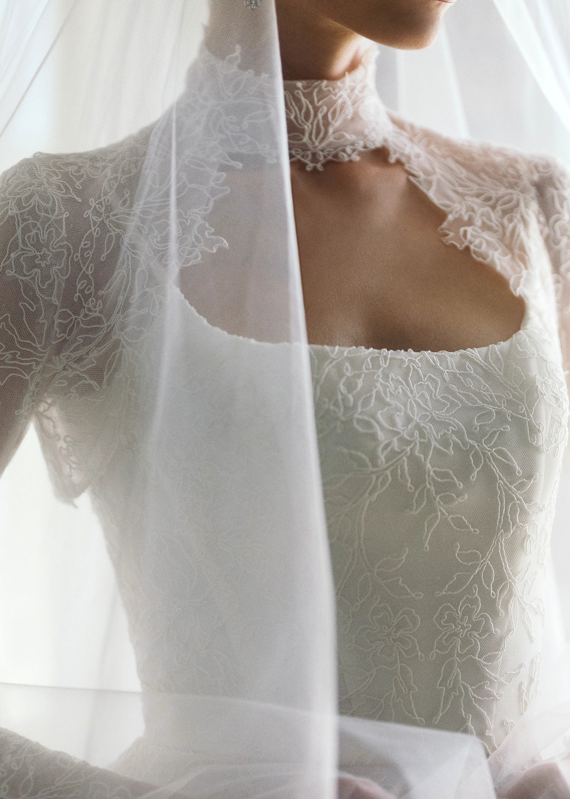 The Blue Willow Brennan Topper is a keyhole illusion tulle topper of Corded Lace with mockneck.