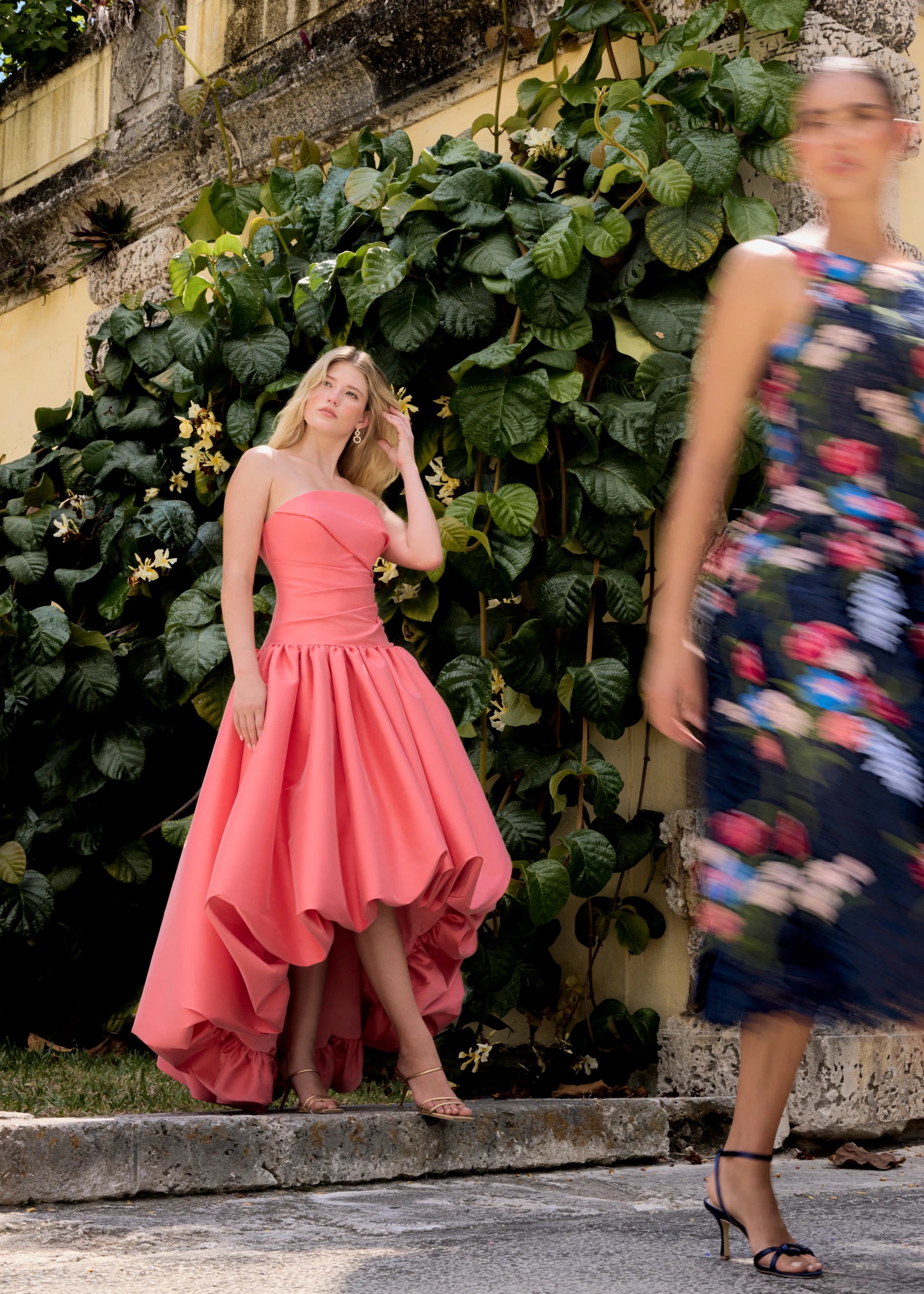 Anne Barge evening gown Consuelo, an arched strapless drop waist bodice with asymmetrical draping and high-low bubble hem gathered skirt.